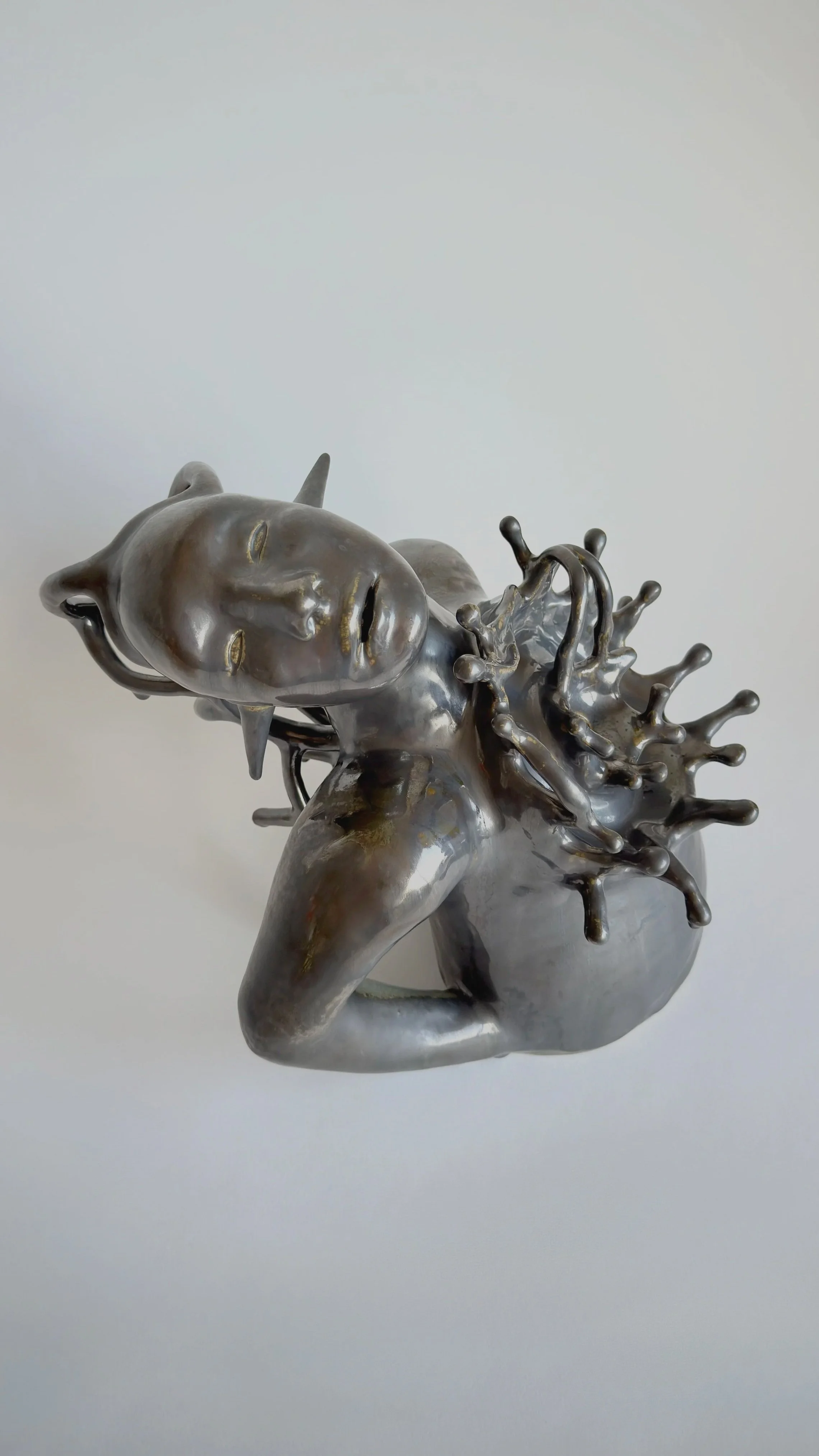 The spirit of the rave - The burning heart -Hand-built stoneware sculpture on a neutral background.