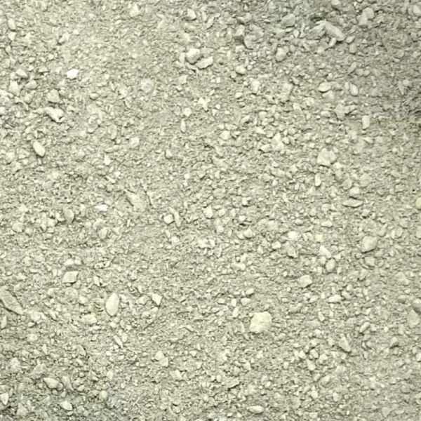 Close-up of a patch of dry, loose dirt or gravel with small rocks.
