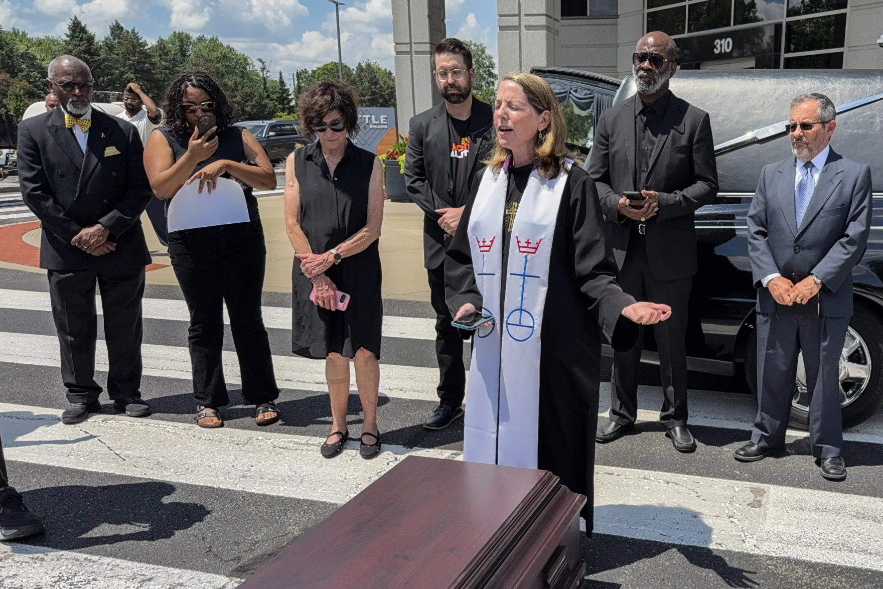 Faith leaders protest federal tax, spending cut bill outside U.S. Sen. Todd Young's office