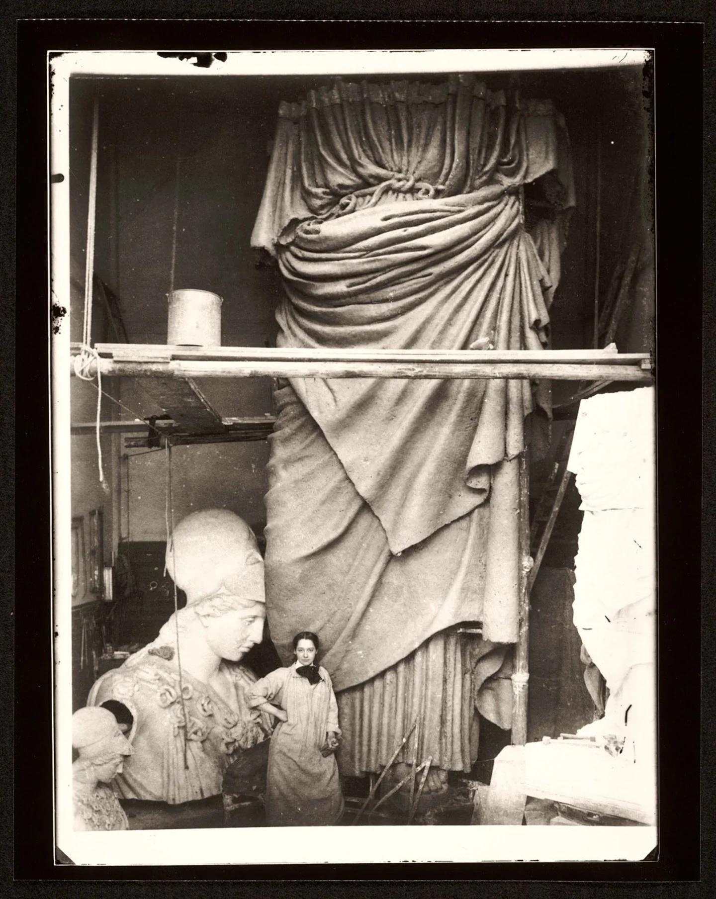 Fill the room.

Photograph of Enid Yandell with her sculpture Pallas Athena, 1896