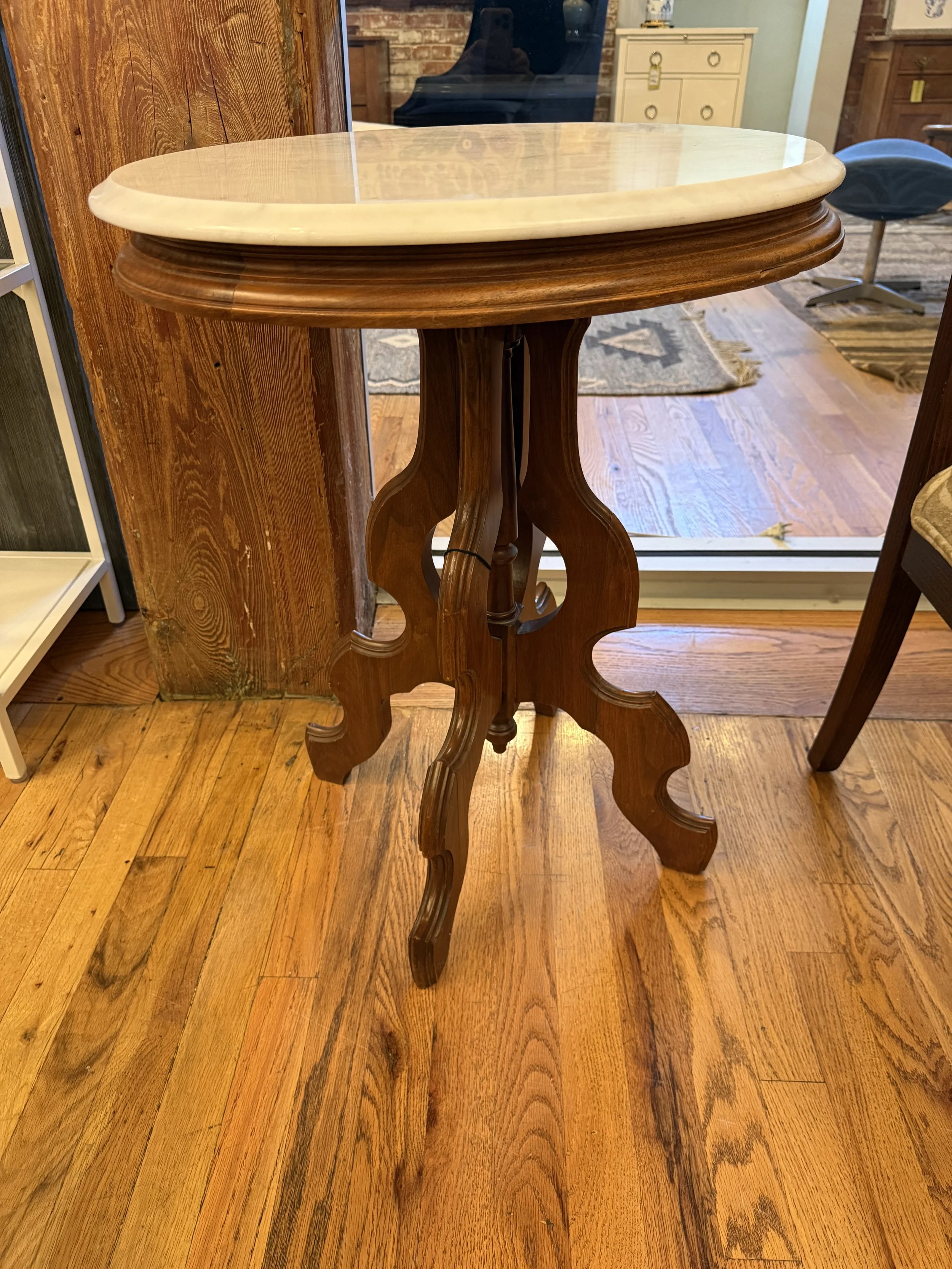 Accent table with carved wood base with marble top 