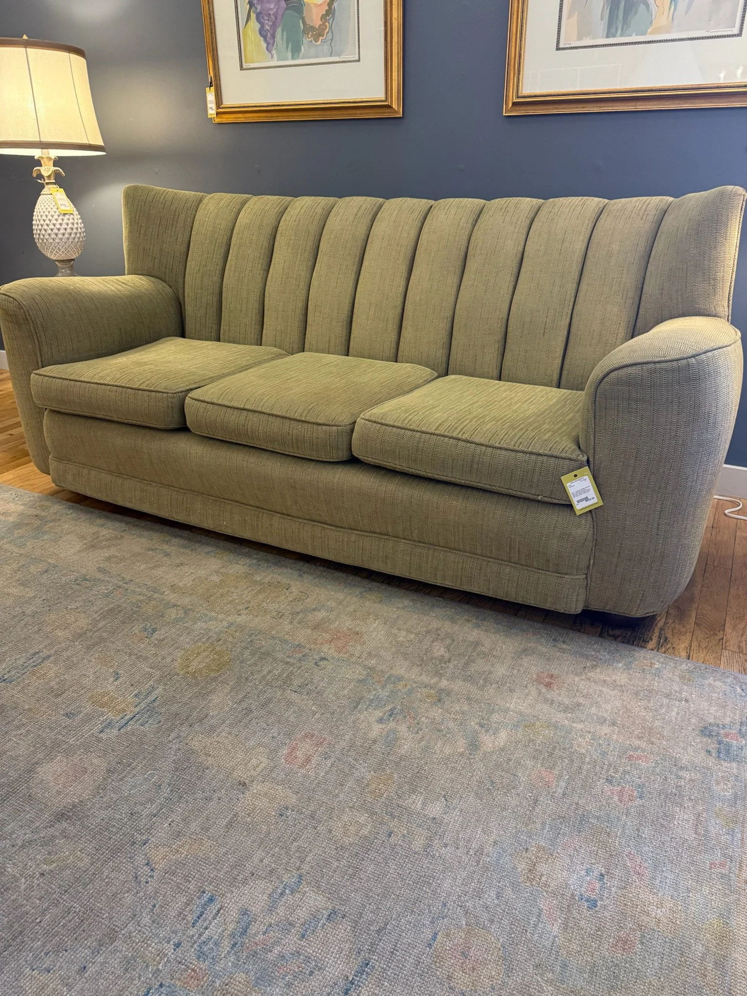 Custom Vintage channel back sofa upholstered in chartreuse-colored textured fabric with high vertical tufted back 