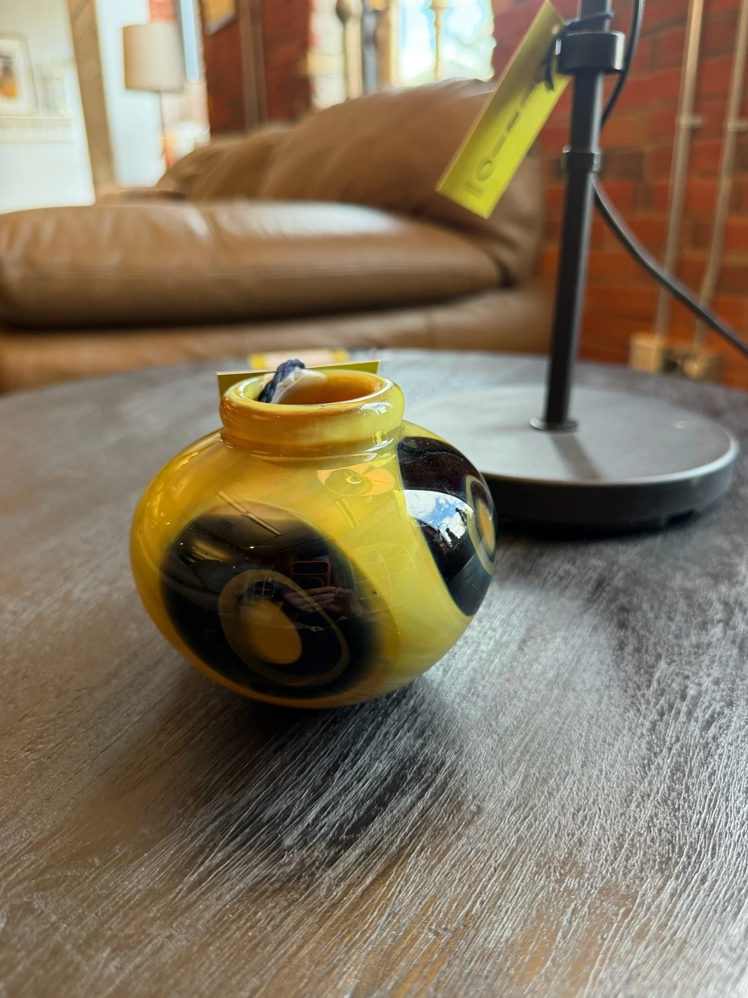 Yellow and black ceramic vase.jpeg