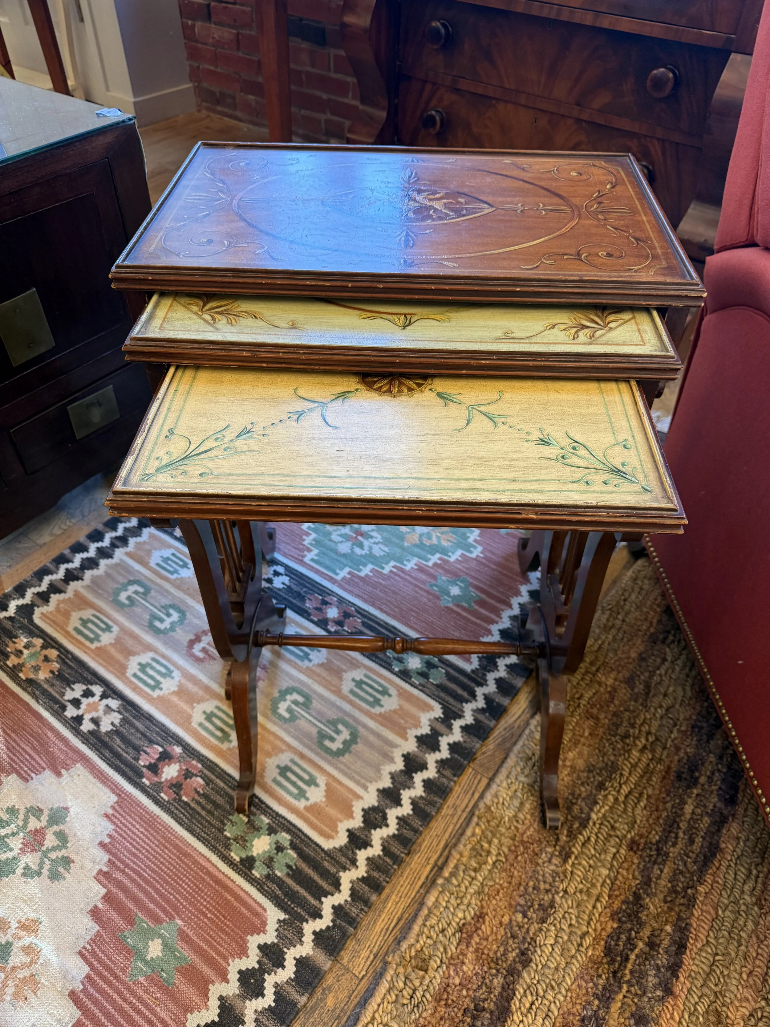 set of 3 hand painted nesting tables in Mahogany with pastel colored floral and neoclassical motifs 
