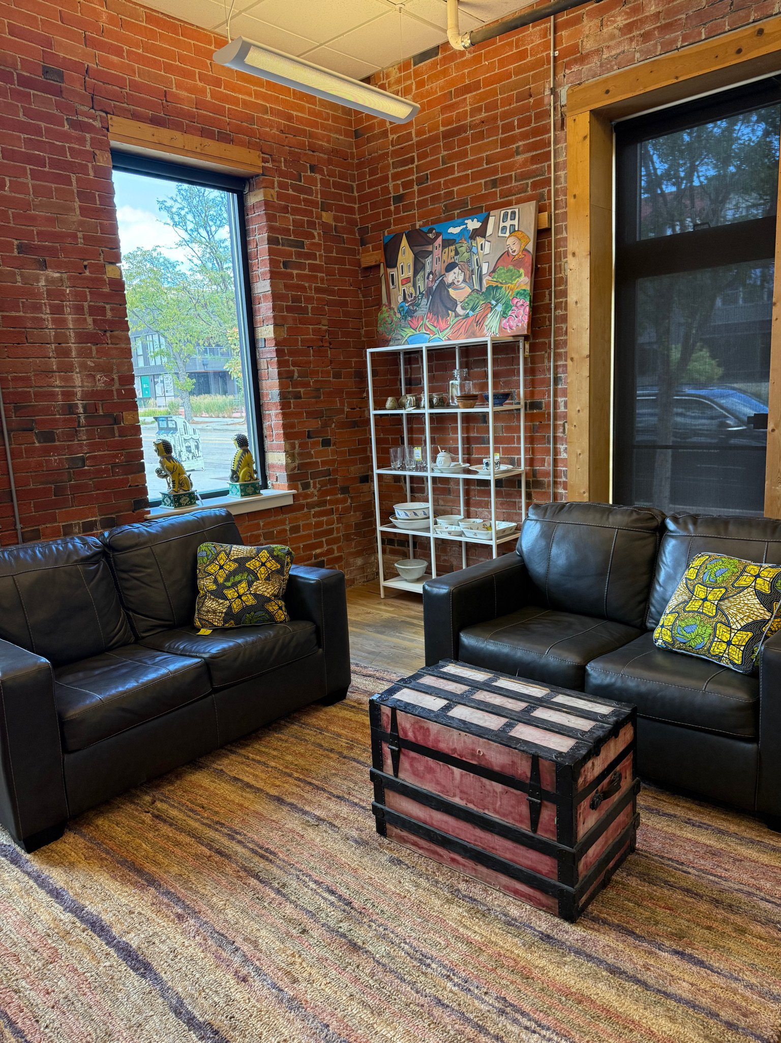A pair of leather loveseats in dark metal grey from Ashley furniture 