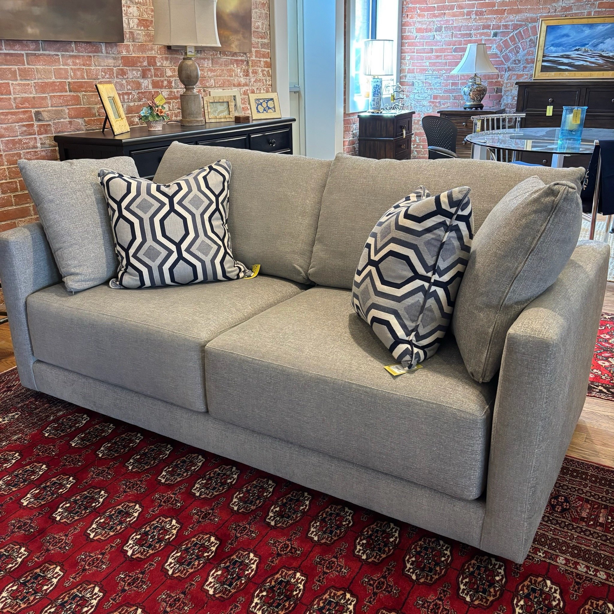 beige sofa and patterned pillows