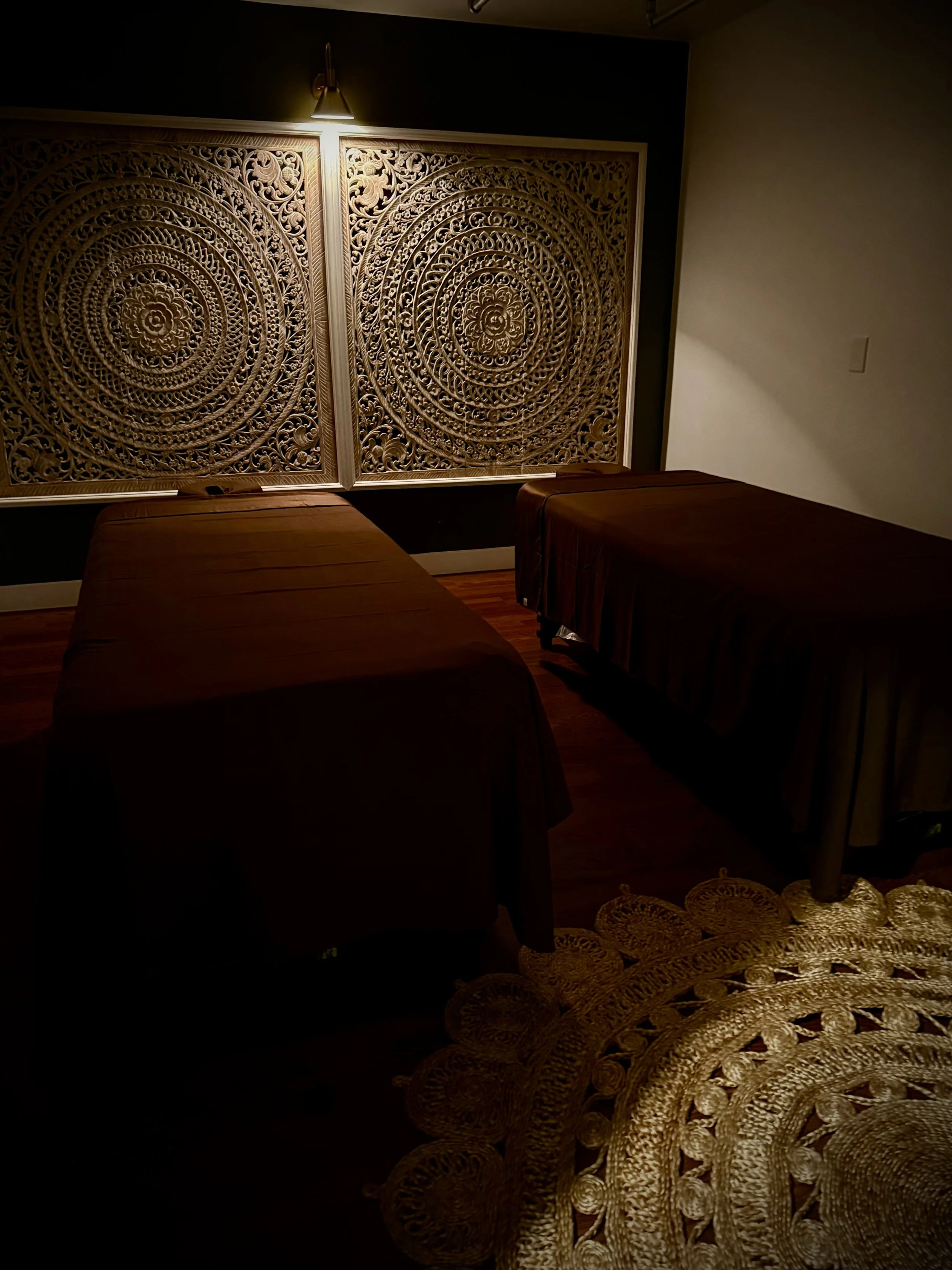 Professional Thai massage therapist applying traditional stretching techniques to improve circulation and flexibility at The Grand Dara in San Diego.