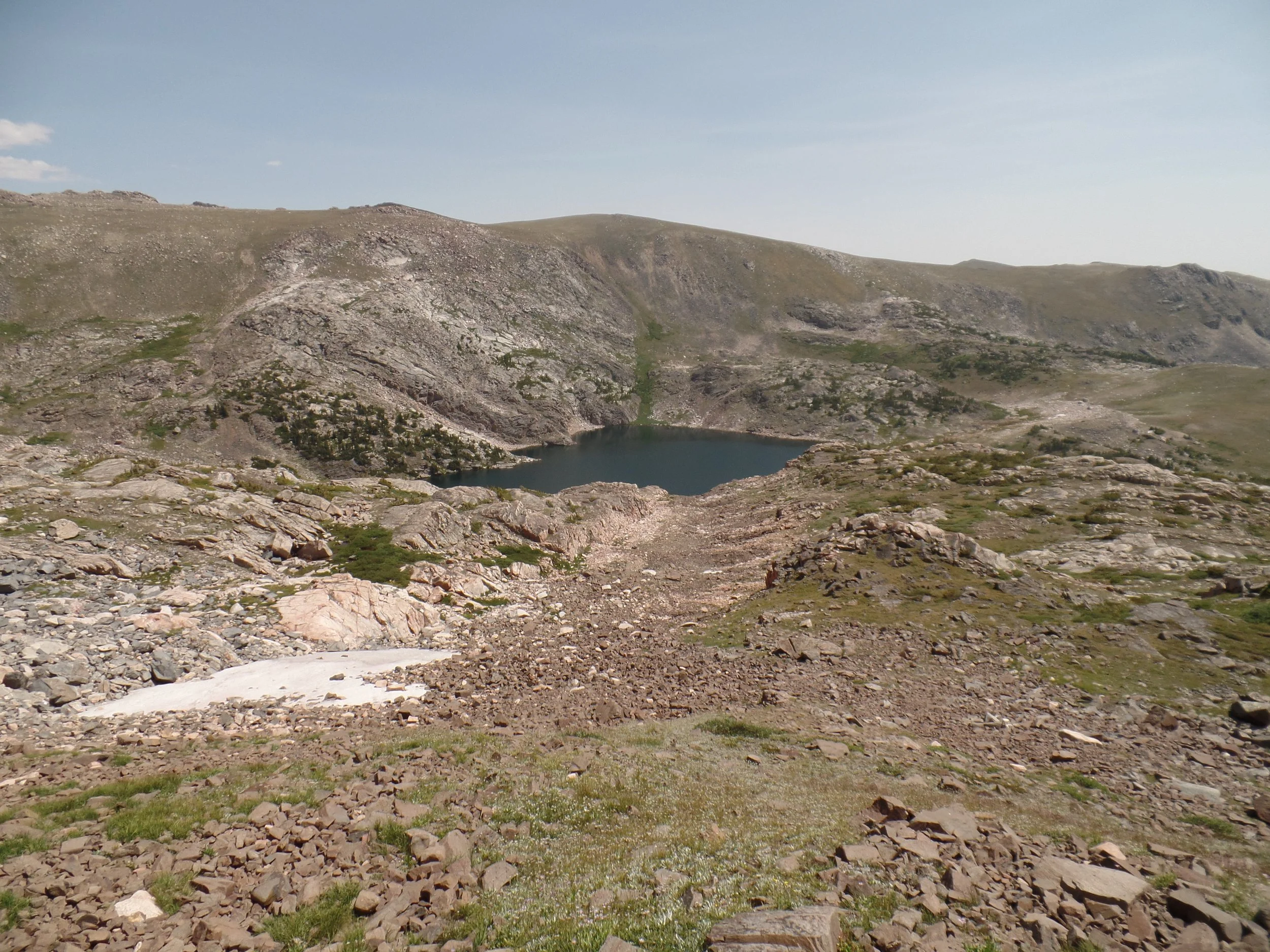 Mountain landscape with rocky terrain and a small lake