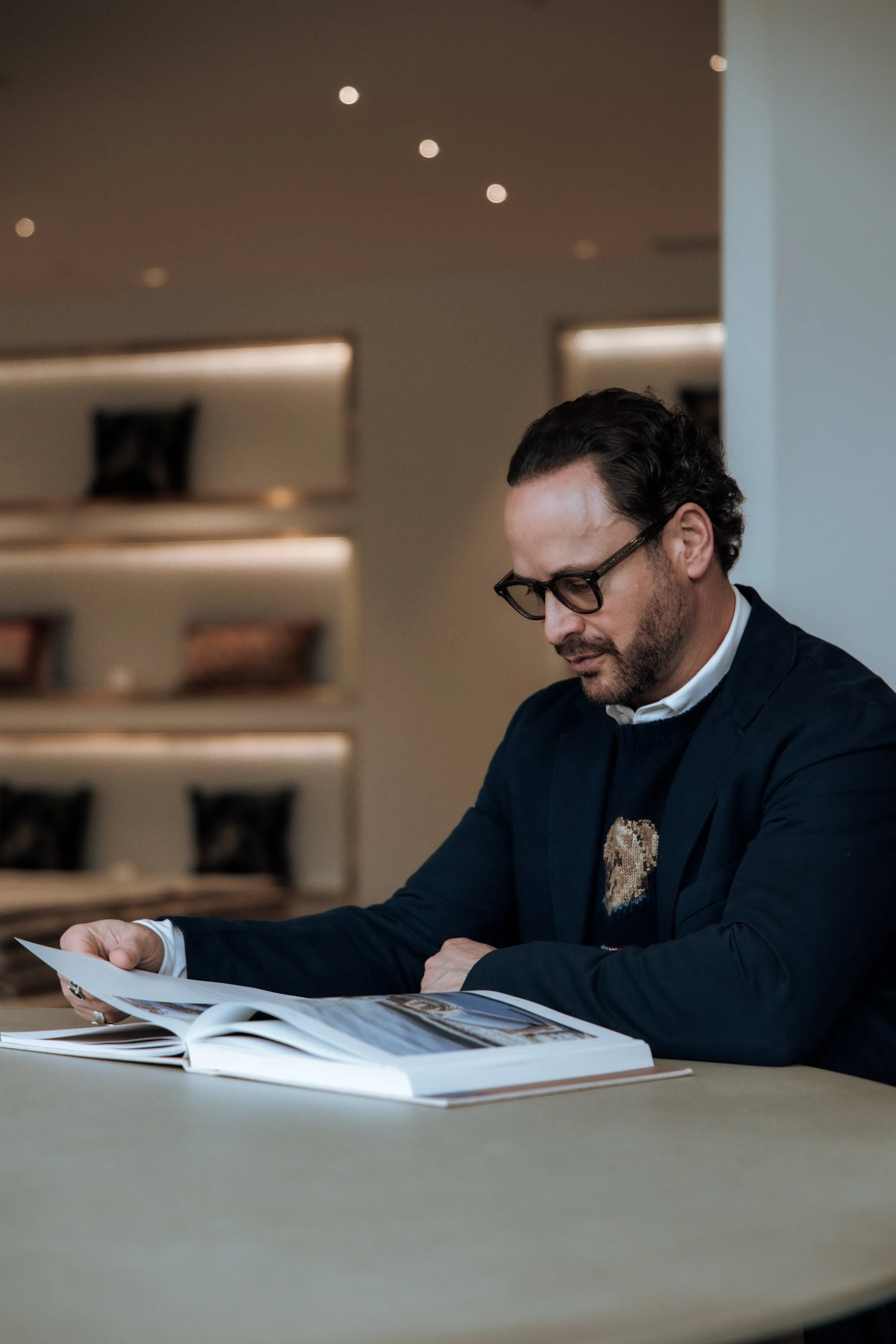 Shaun Ford with an interior design book