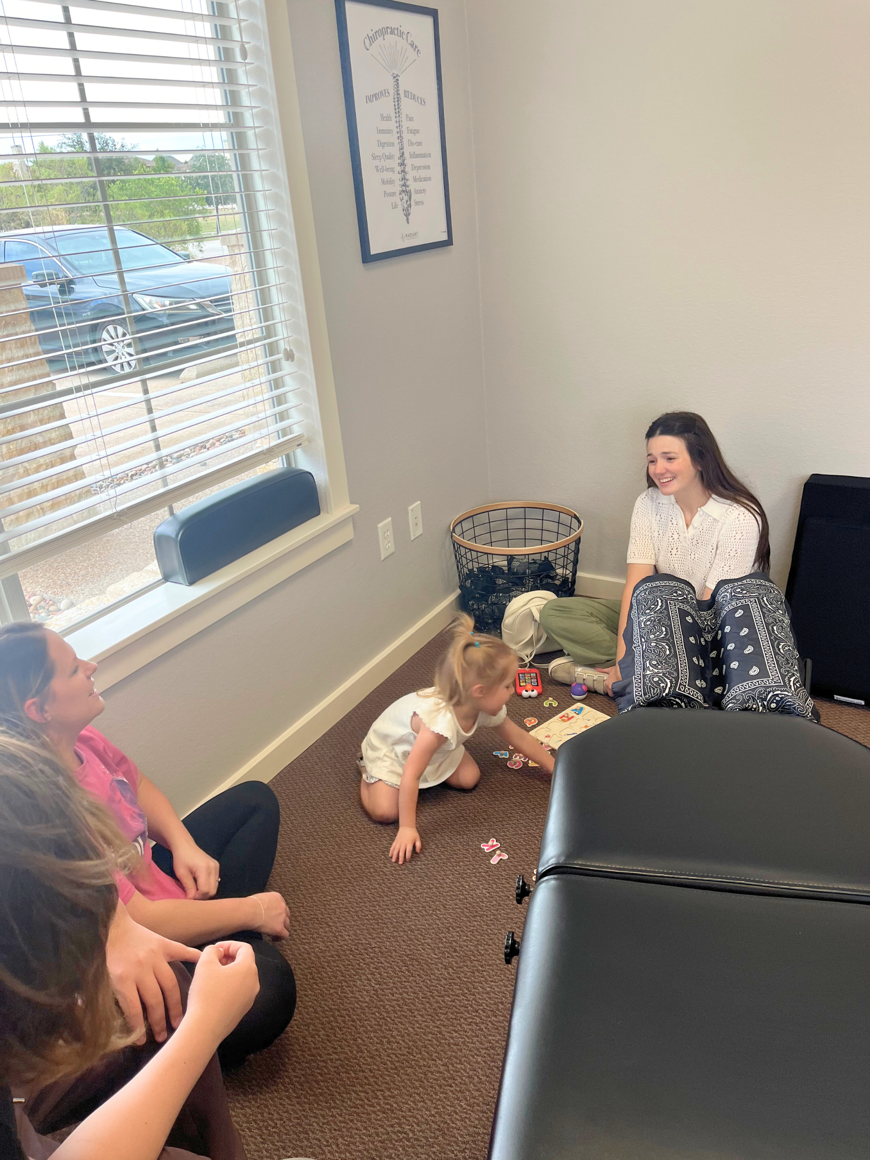 Children and parents in the waiting room at radiant chiropractic