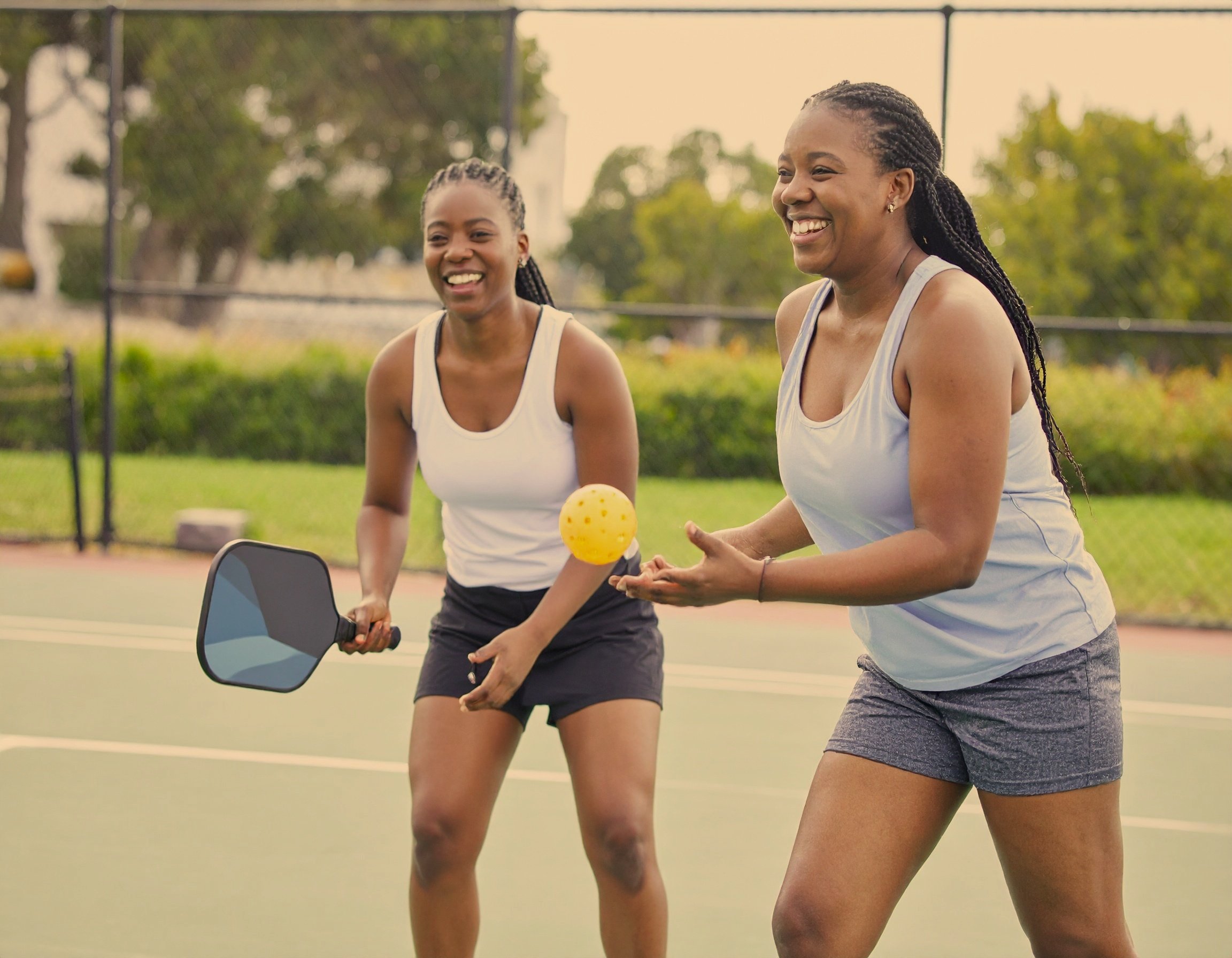 Firefly_two+black+women+playing+pickle+ball+outside+335512.jpg