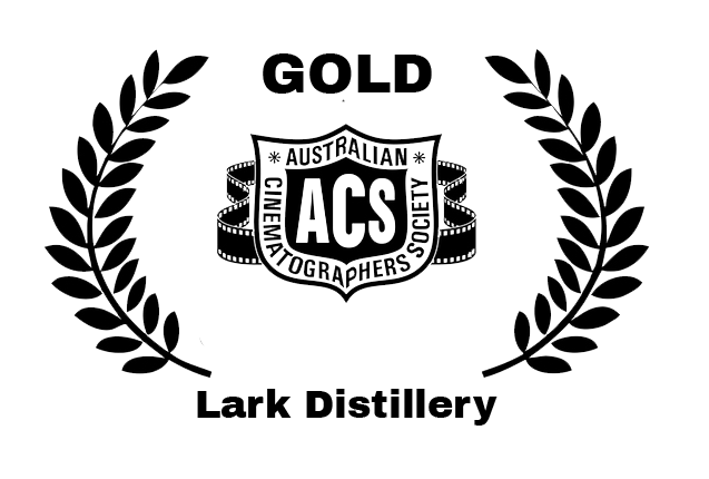 Logo for Australian Cinematographers Society with laurel branches on each side.