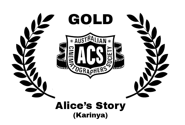 Logo for the Australian Cinematographers Society with a shield design, laurel branches on each side, and the ACs initials in the center.