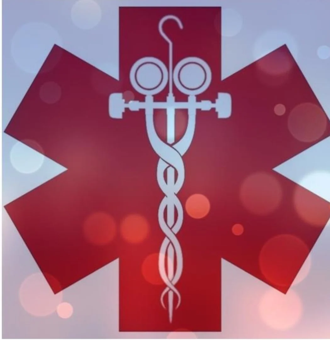Medical symbol with red star of life and caduceus, blurred background