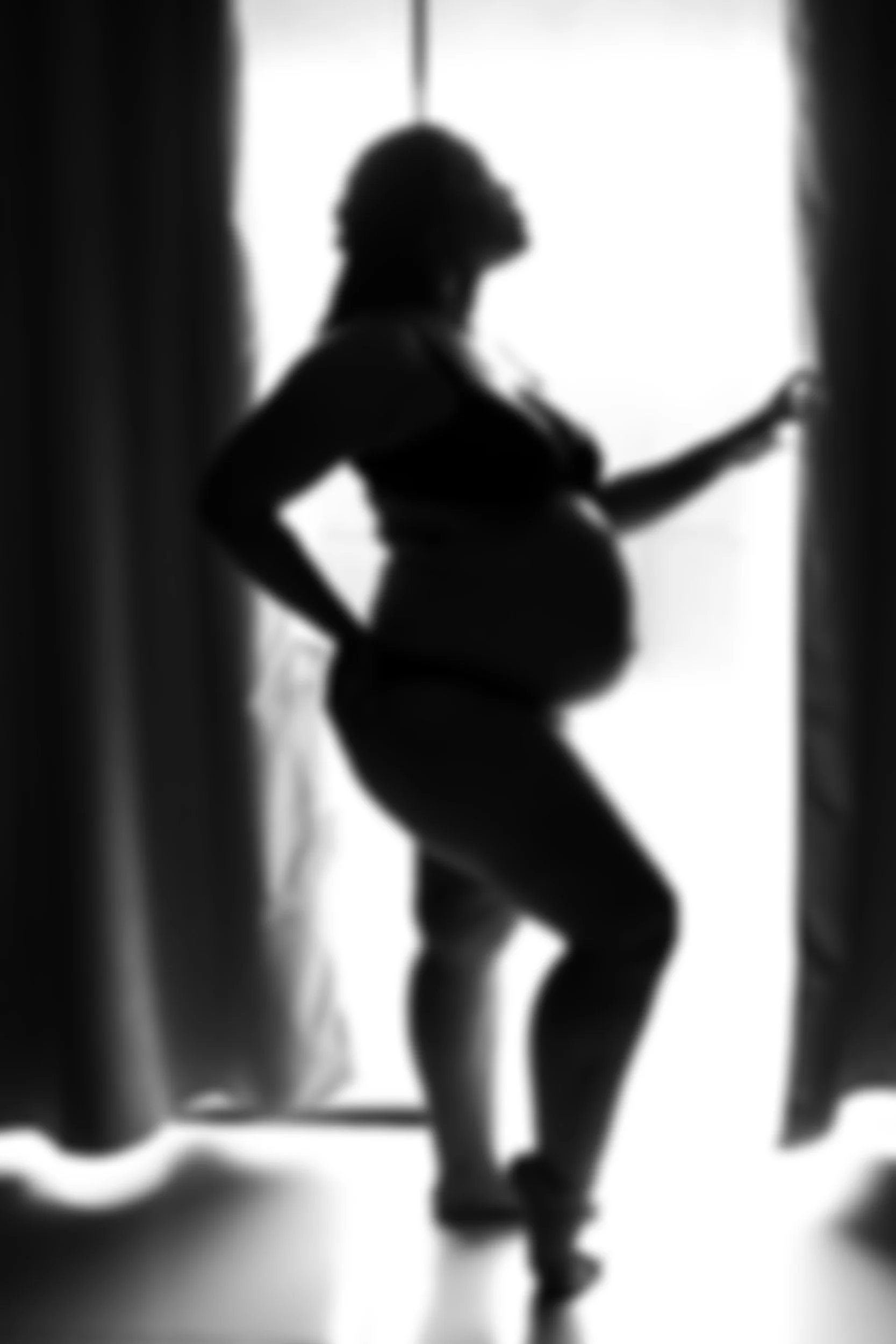 Stock image of pregnant person (blurred for affect).