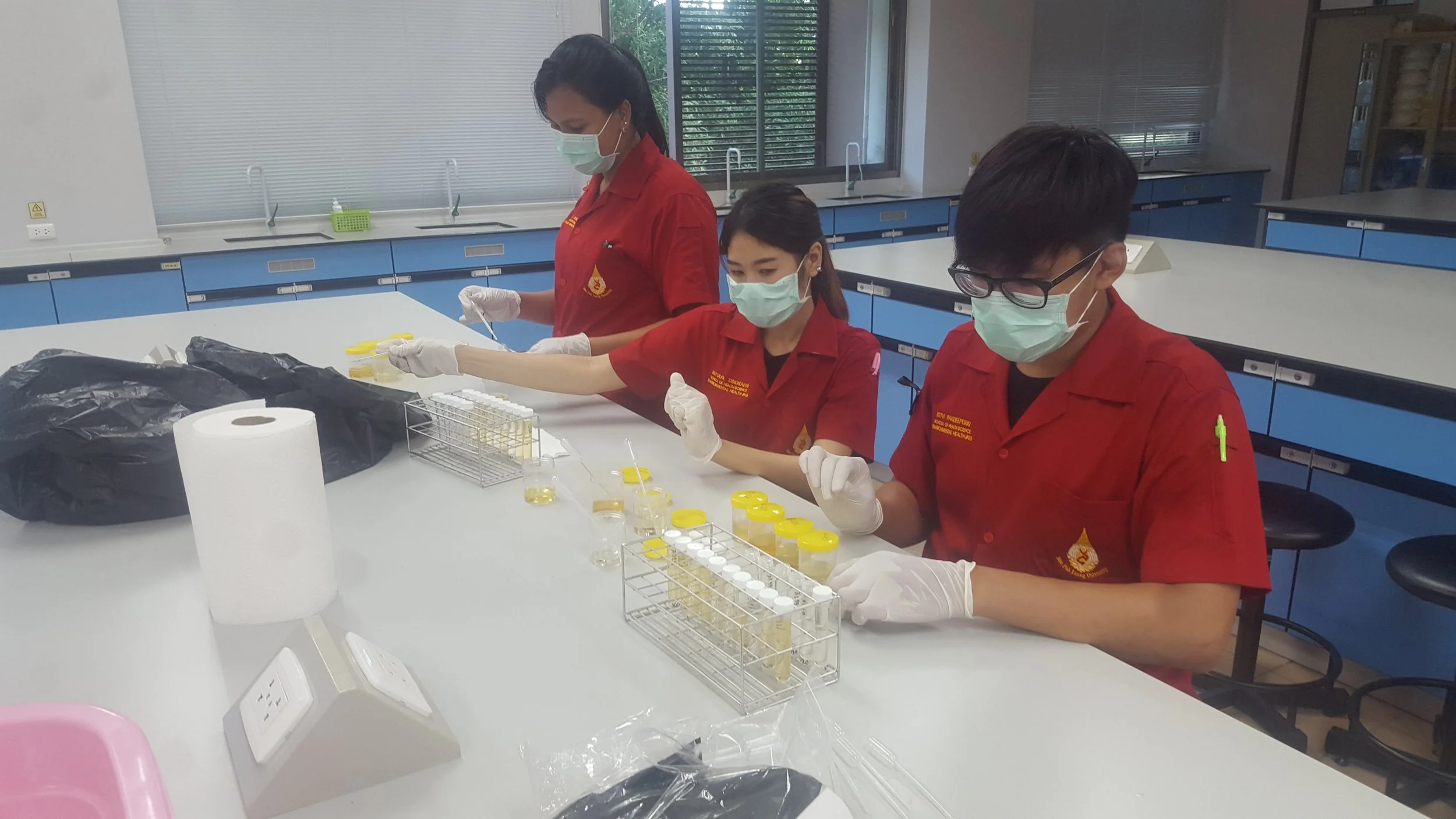 Mae Fat Luang University Research students aliquoting urine samples for pesticide analysis