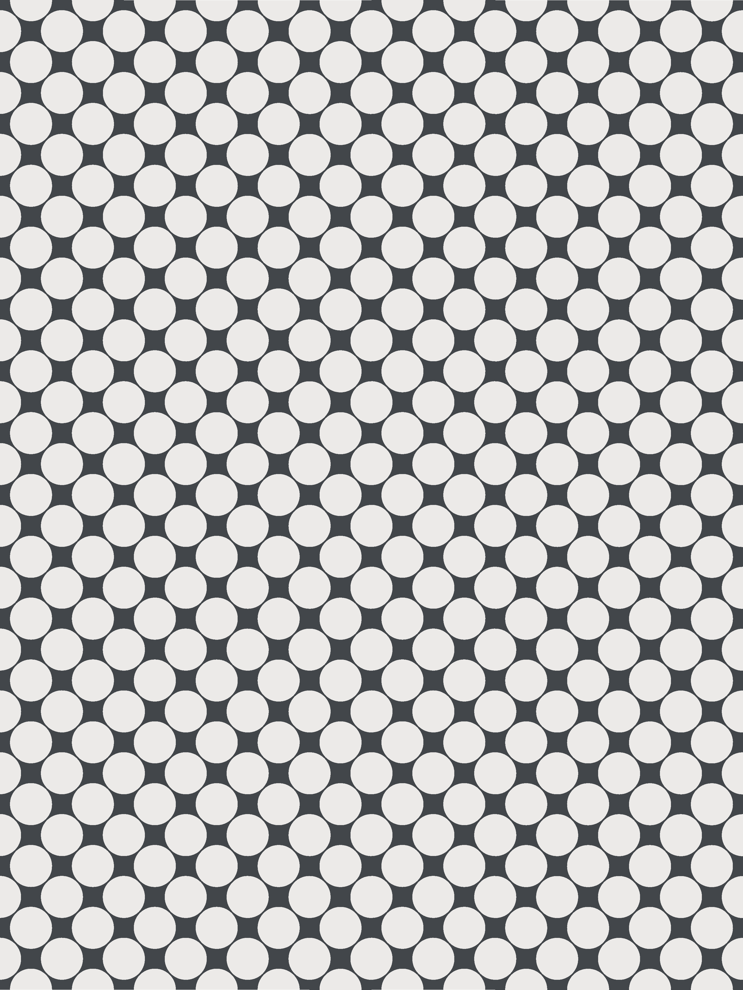 Modern interior wall with a geometric pattern of triangular tiles in pink shades, accented with small blue and white triangular tiles, with a strip of lighting along the bottom.