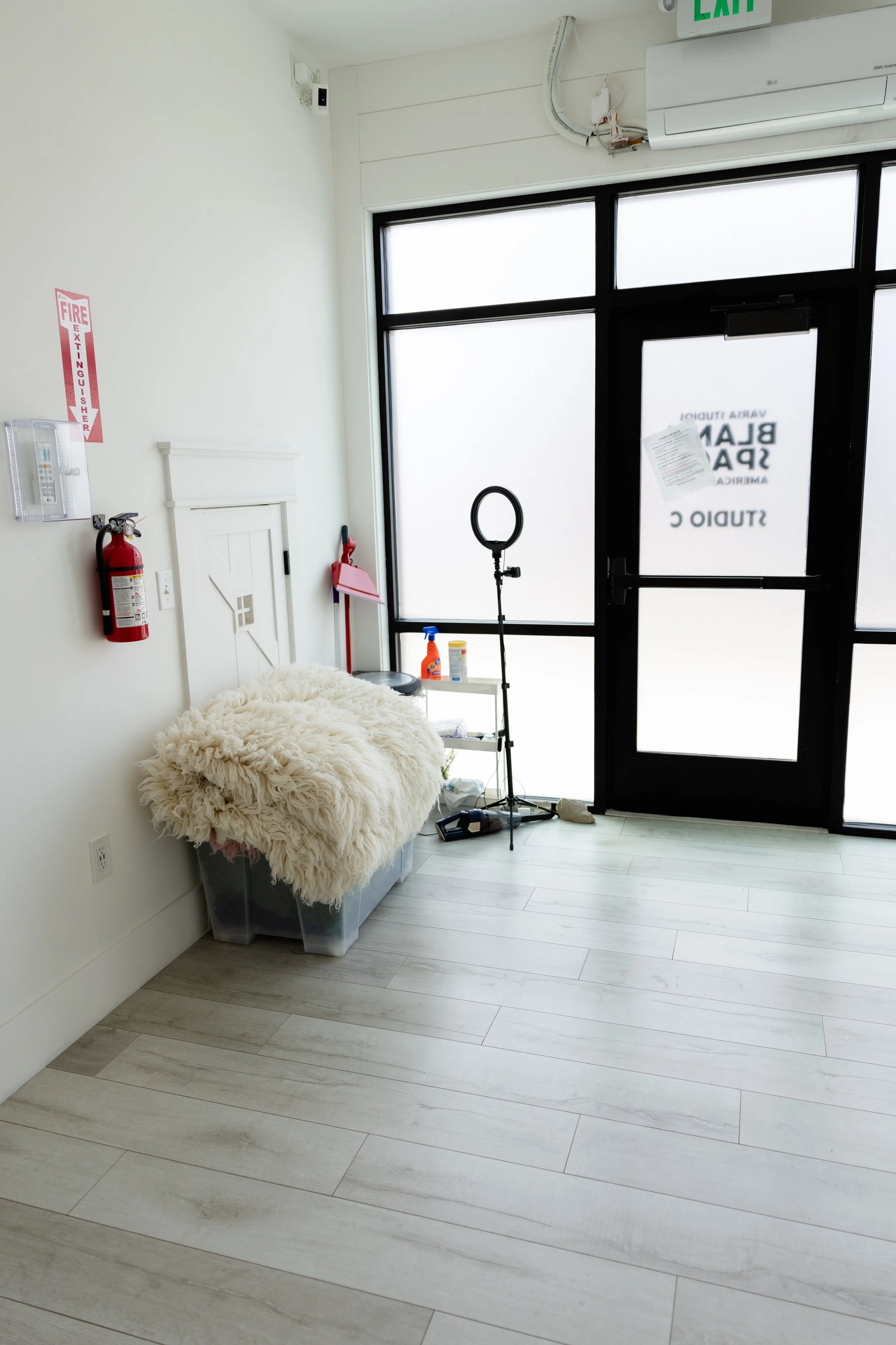 Newborn posing area in Studio C at Blank Space American Fork featuring a fluffy neutral posing surface, natural light, and clean white studio walls.