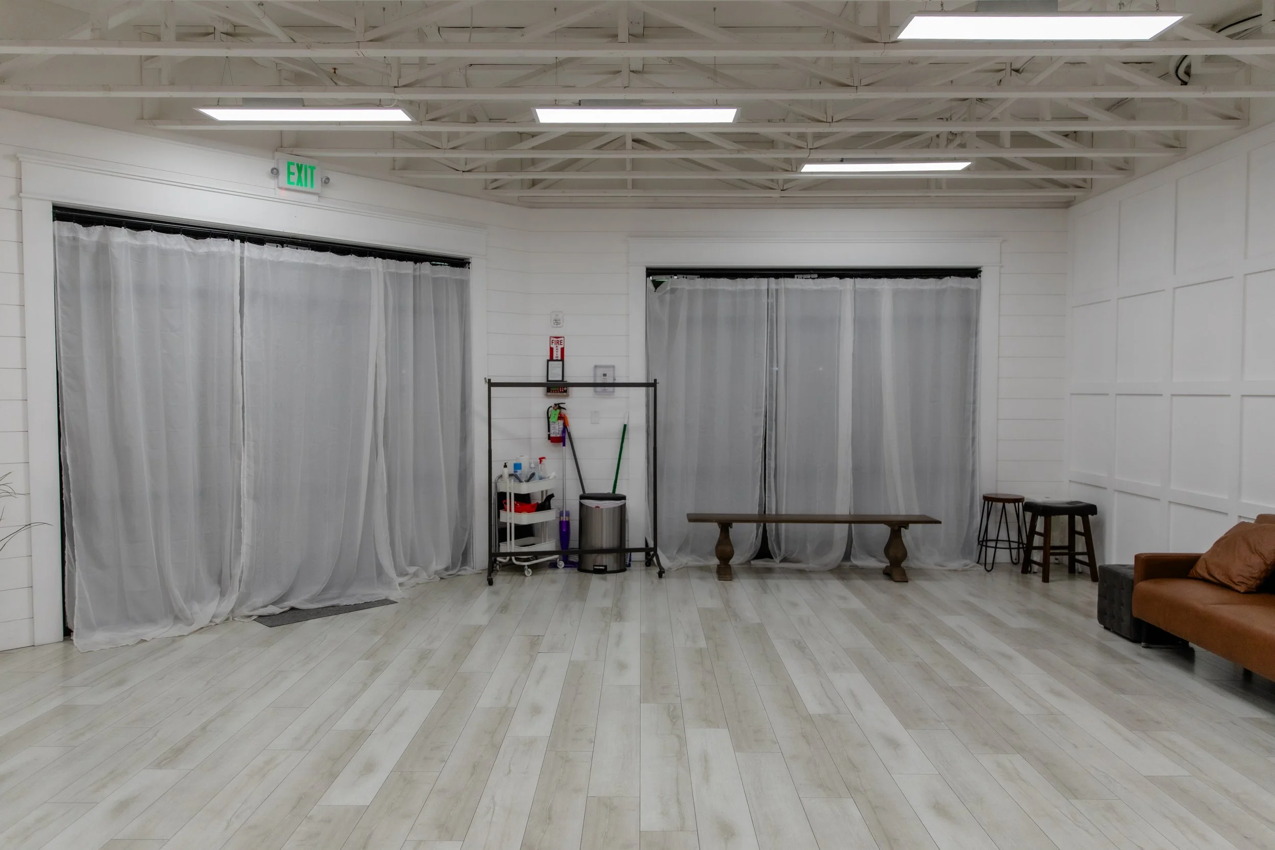 Natural light windows and open shooting space in Studio A at Varsa Studios American Fork, Utah, designed for photographers and content creators needing bright light, neutral walls, and flexible layout options.
