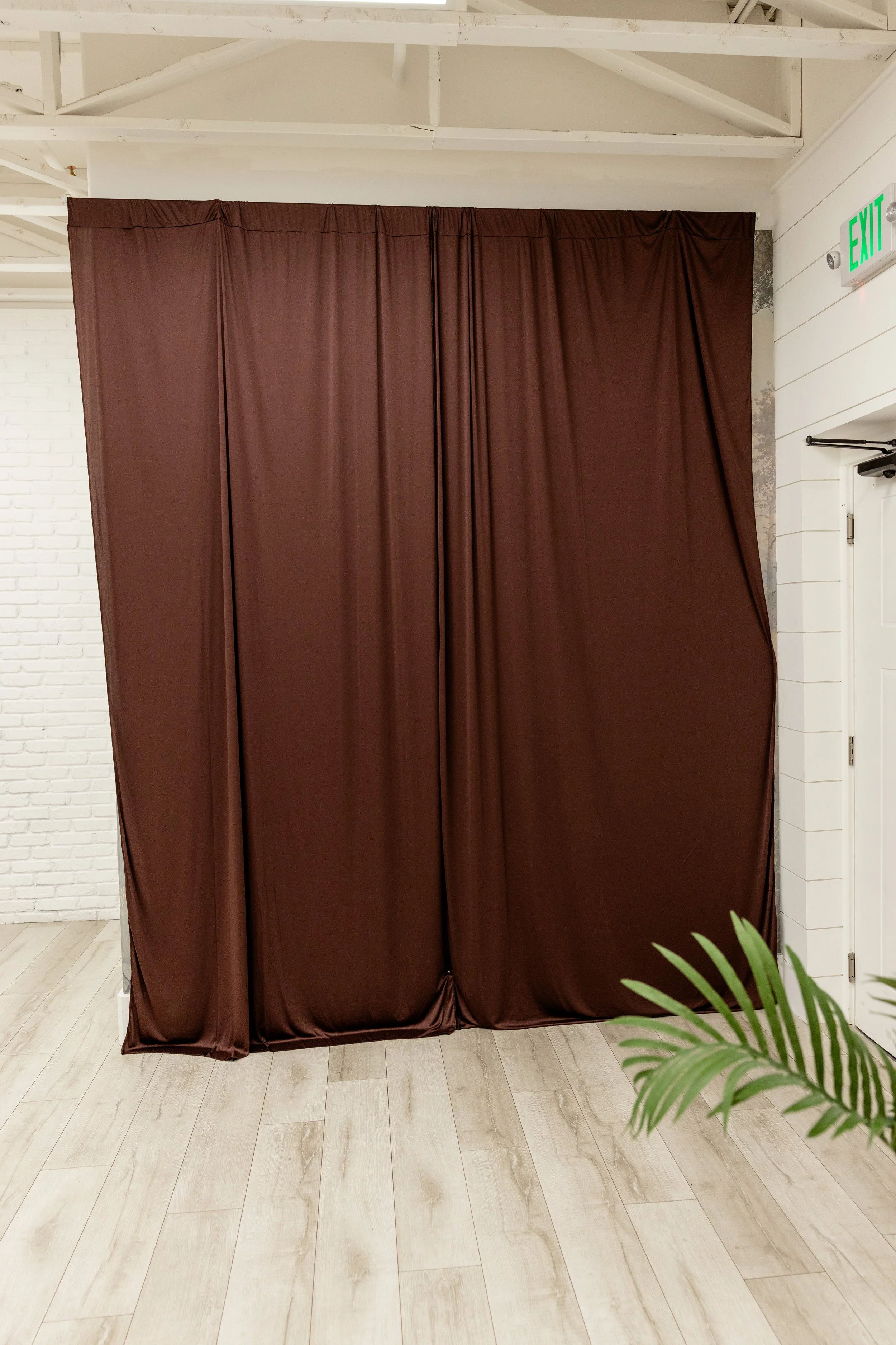 Brown fabric backdrop inside Studio A at Varsa Studios in American Fork Utah, versatile photo studio rental in Utah County with neutral backdrop for branding photography, headshots, content creator studio sessions, portrait photography and small even