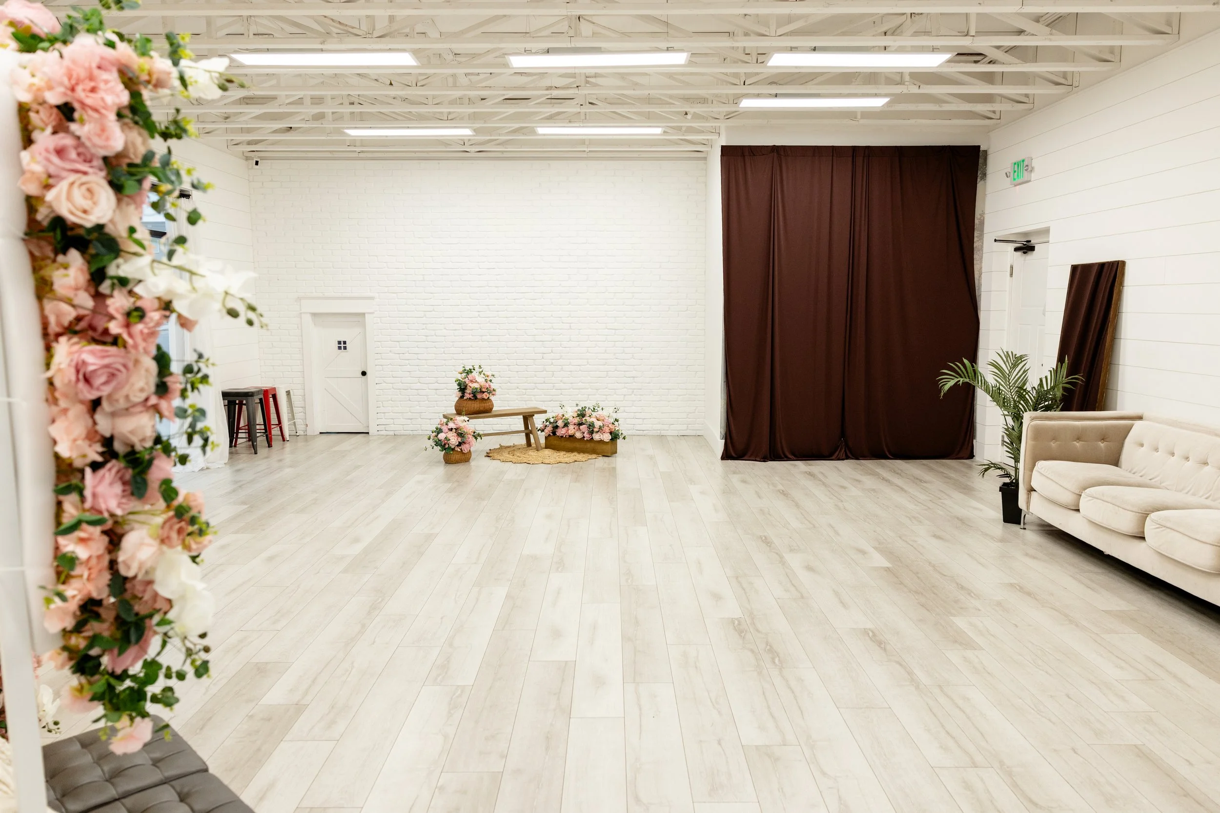 Brown fabric backdrop inside Studio A at Varsa Studios in American Fork Utah, versatile photo studio rental in Utah County with neutral backdrop for branding photography, headshots, content creator studio sessions, portrait photography and small even