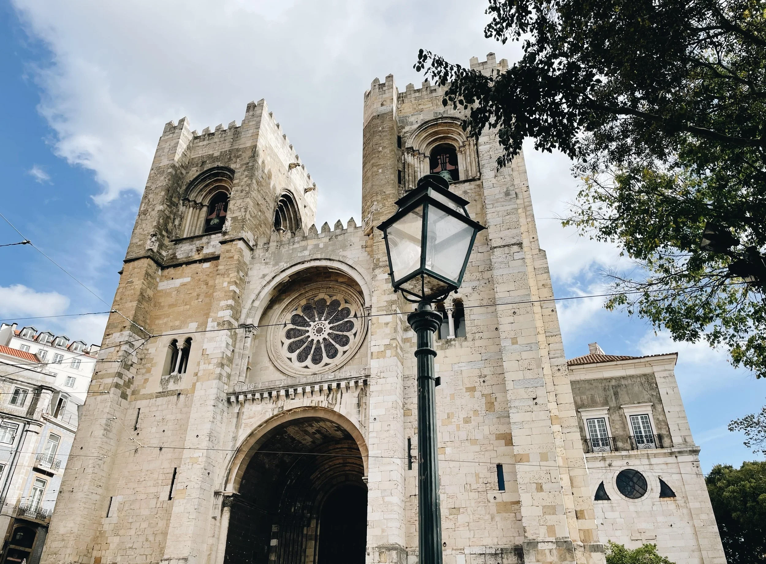 The Lisbon Cathedral in Portugal, a Romanesque landmark framed by timeless stonework and the elegance of Lisbon’s historic Alfama district.