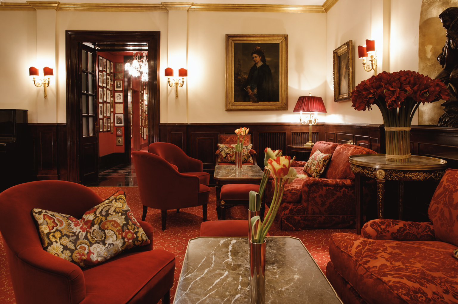 Elegant red salon and lounge inside the historic Hotel Sacher Wien in Vienna
