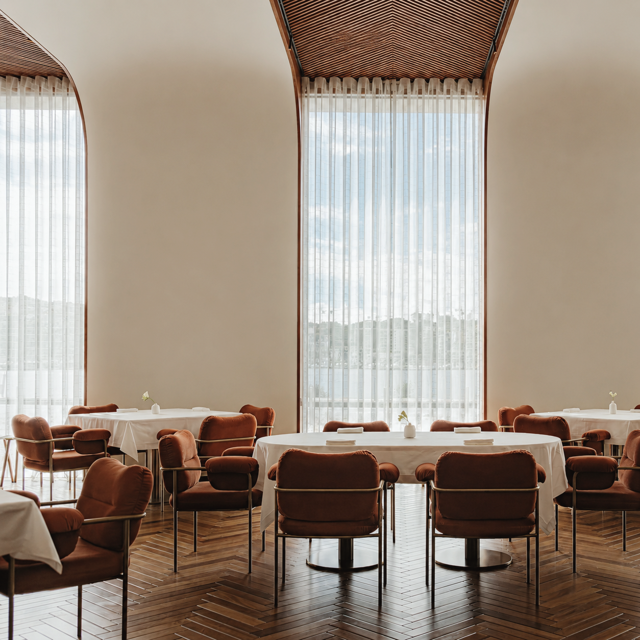 Pedro Lemos fine dining restaurant in Porto, Portugal, featuring an elegant contemporary dining room with refined table settings, warm wood floors, and natural light.