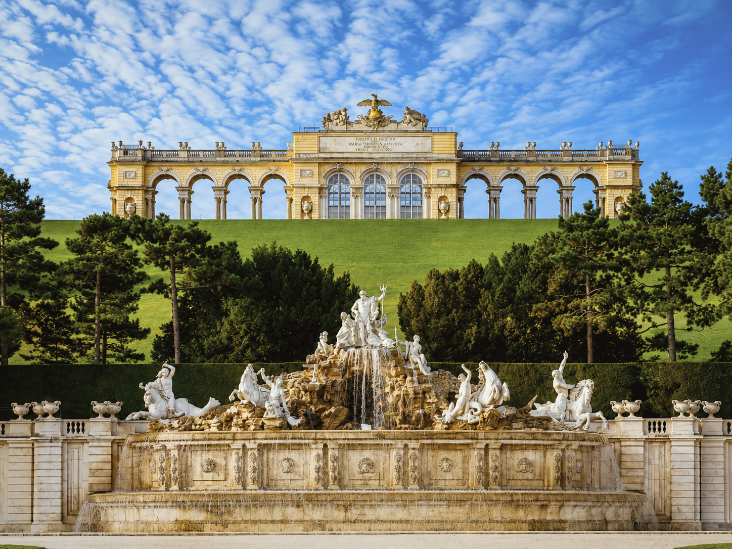 Gloriette and Neptune Fountain in the gardens of Schönbrunn Palace in Vienna