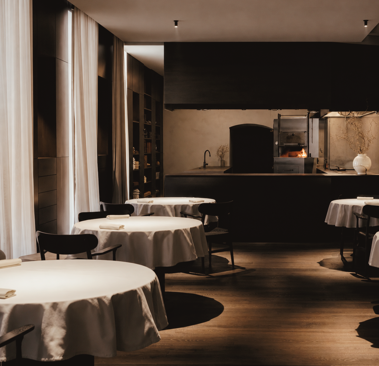 Intimate open-fire dining room at Doubek restaurant in Vienna