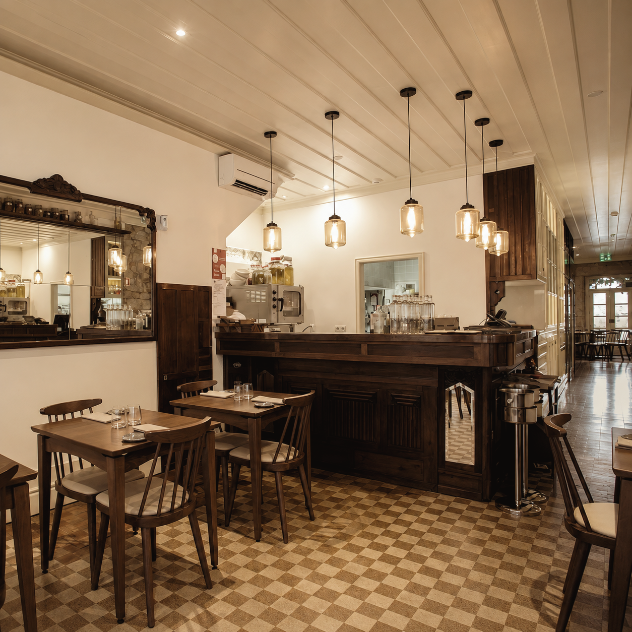 Almeja restaurant in Porto, Portugal, featuring a warm contemporary dining room with wood furnishings, tiled floors, pendant lighting, and an intimate neighborhood atmosphere.