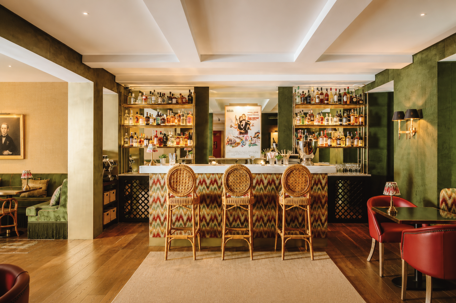 Stylish bar at Hotel das Amoreiras in Lisbon, Portugal, featuring a patterned bar, rattan stools, warm wood floors, and an intimate boutique atmosphere.