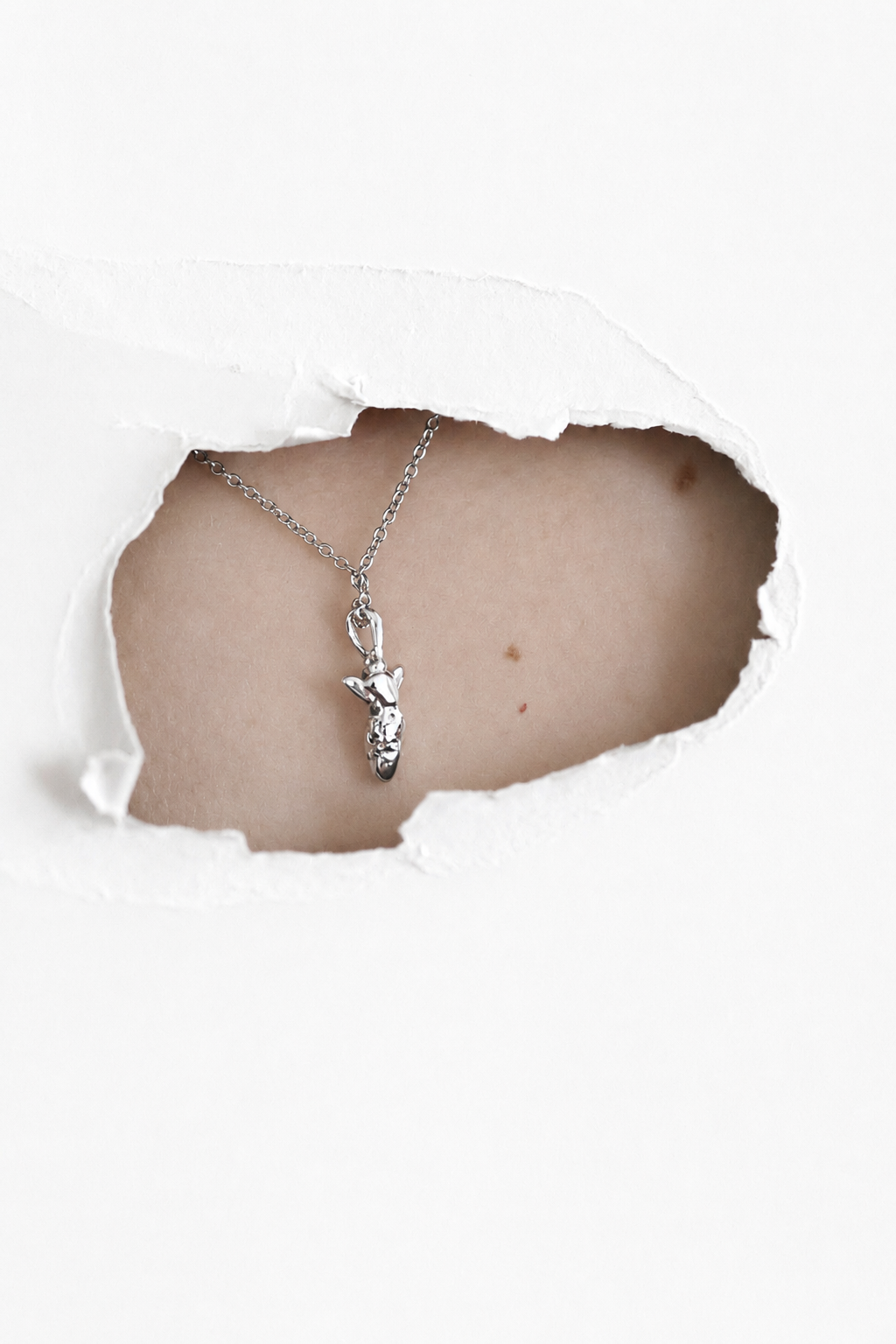 silver-bunny-pendant-necklace-on-skin.png