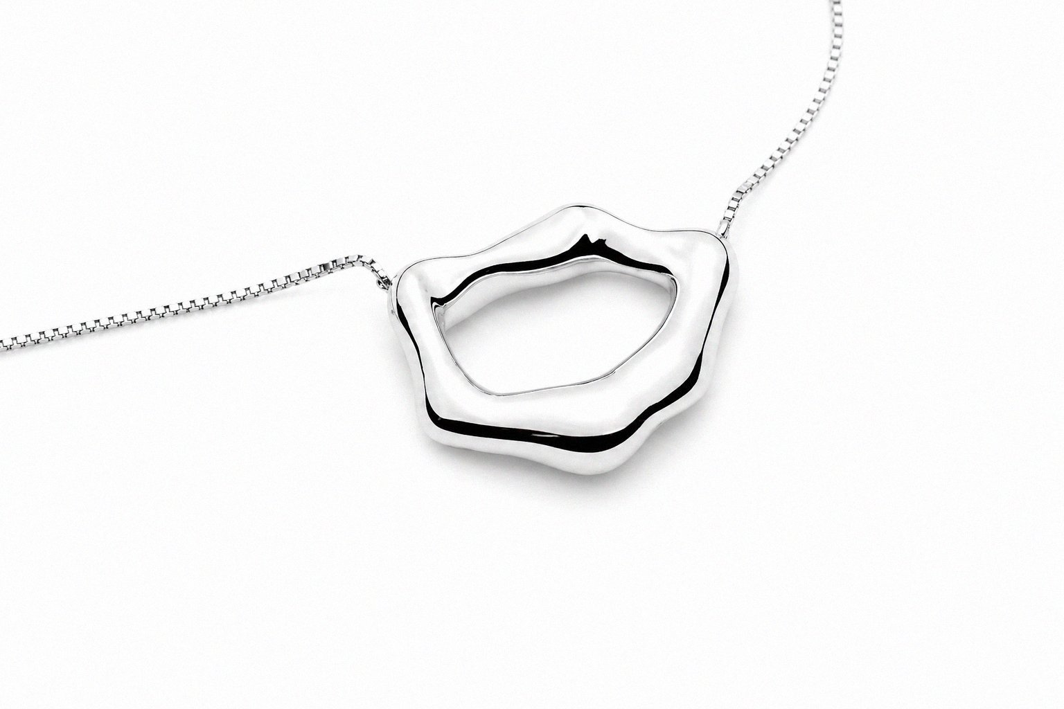 sterling-silver-open-organic-ring-pendant-necklace-angled-view.png