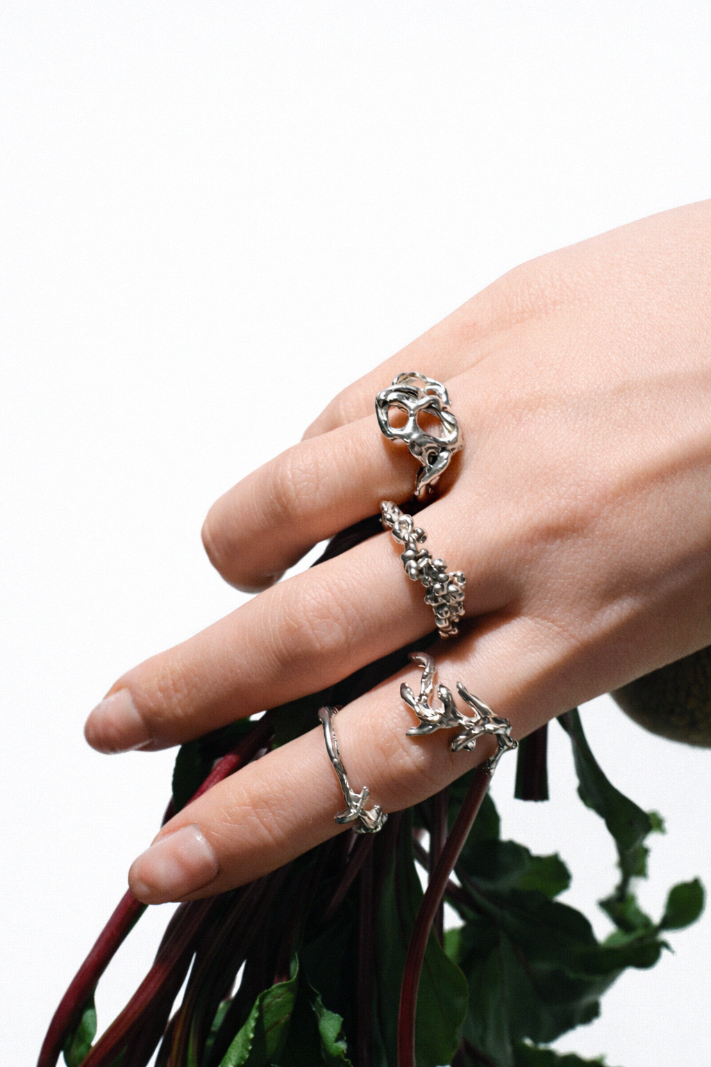 Nature-inspired handmade sterling silver rings by Etti Jewelry, sculptural organic designs