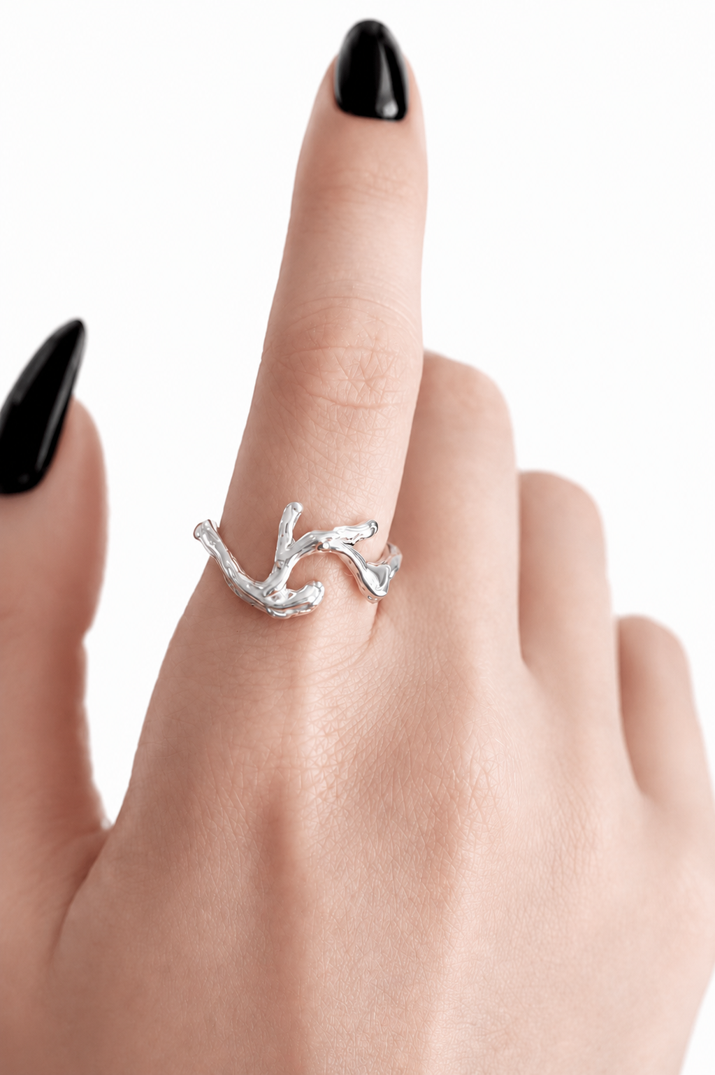 silver-branch-ring-on-index-finger.png