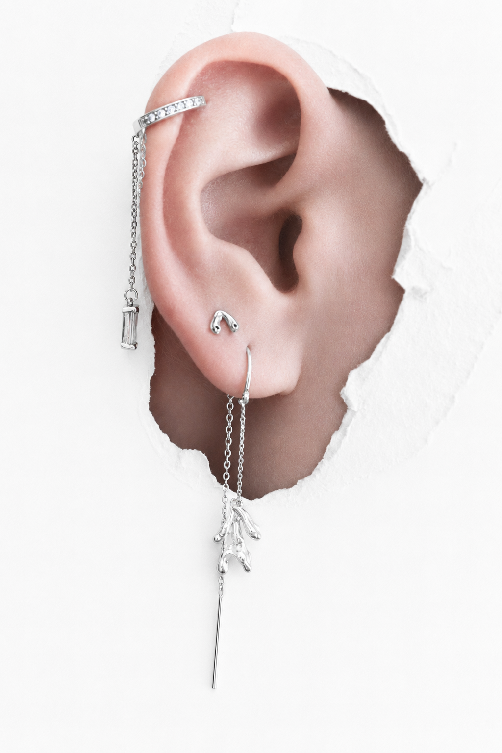 silver-ear-stack-crystal-huggie-and-coral-drop-earrings.png