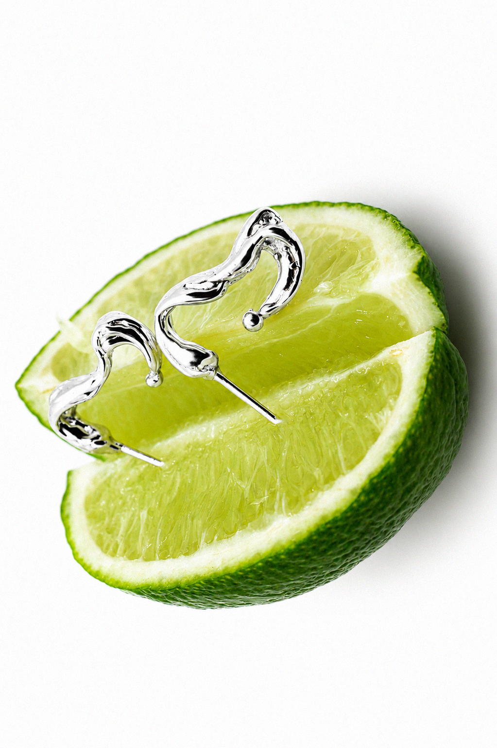 sculptural-sterling-silver-pendant-necklaces-with-lime.png