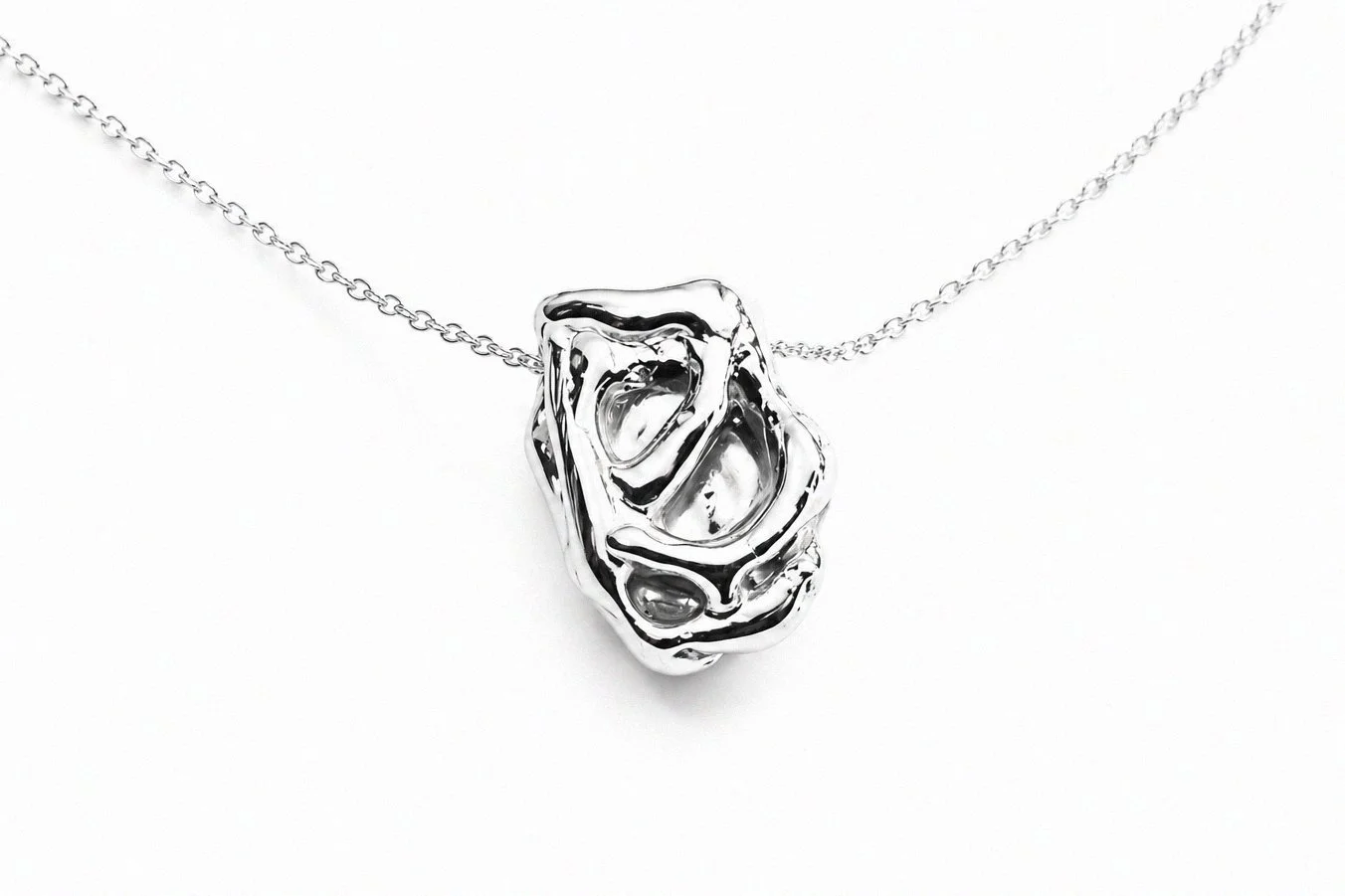 sterling-silver-hollow-sculptural-organic-pendant-necklace-angled-view.png