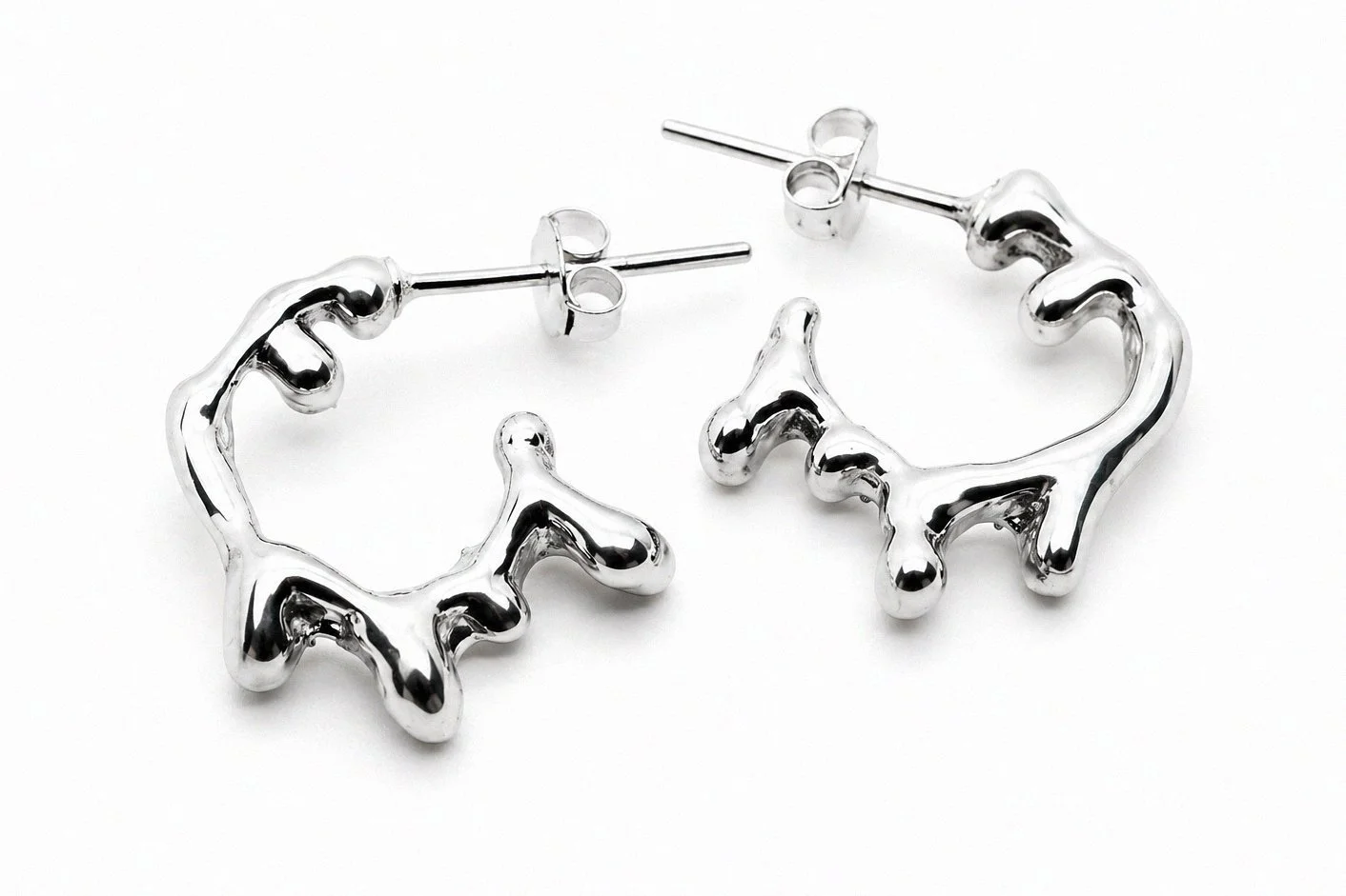 sterling-silver-organic-drip-blob-hoop-earrings-angled-view-pair.png
