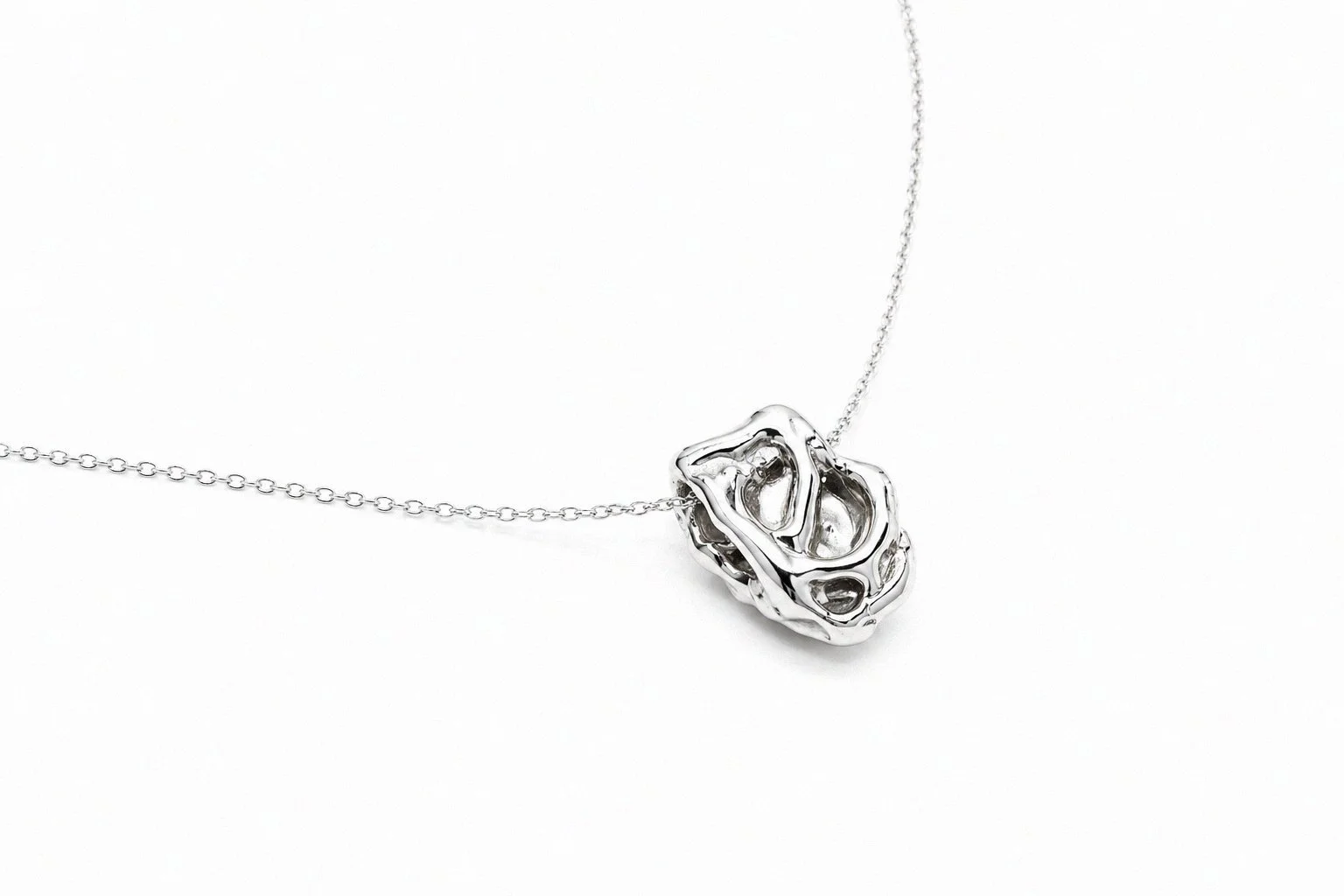 sterling-silver-hollow-sculptural-organic-pendant-necklace-side-view.png