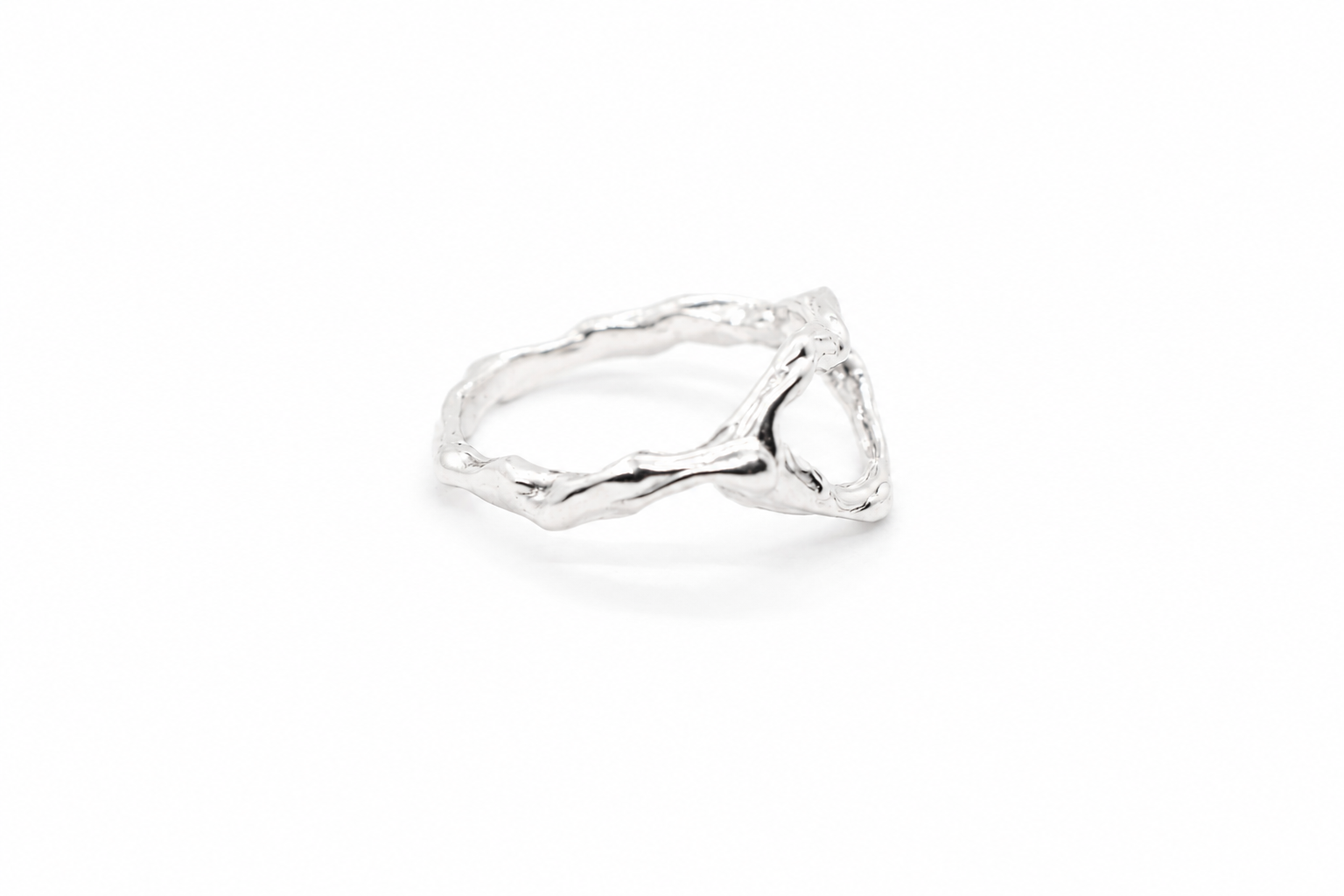 silver-triangular-textured-ring-angled-view.png