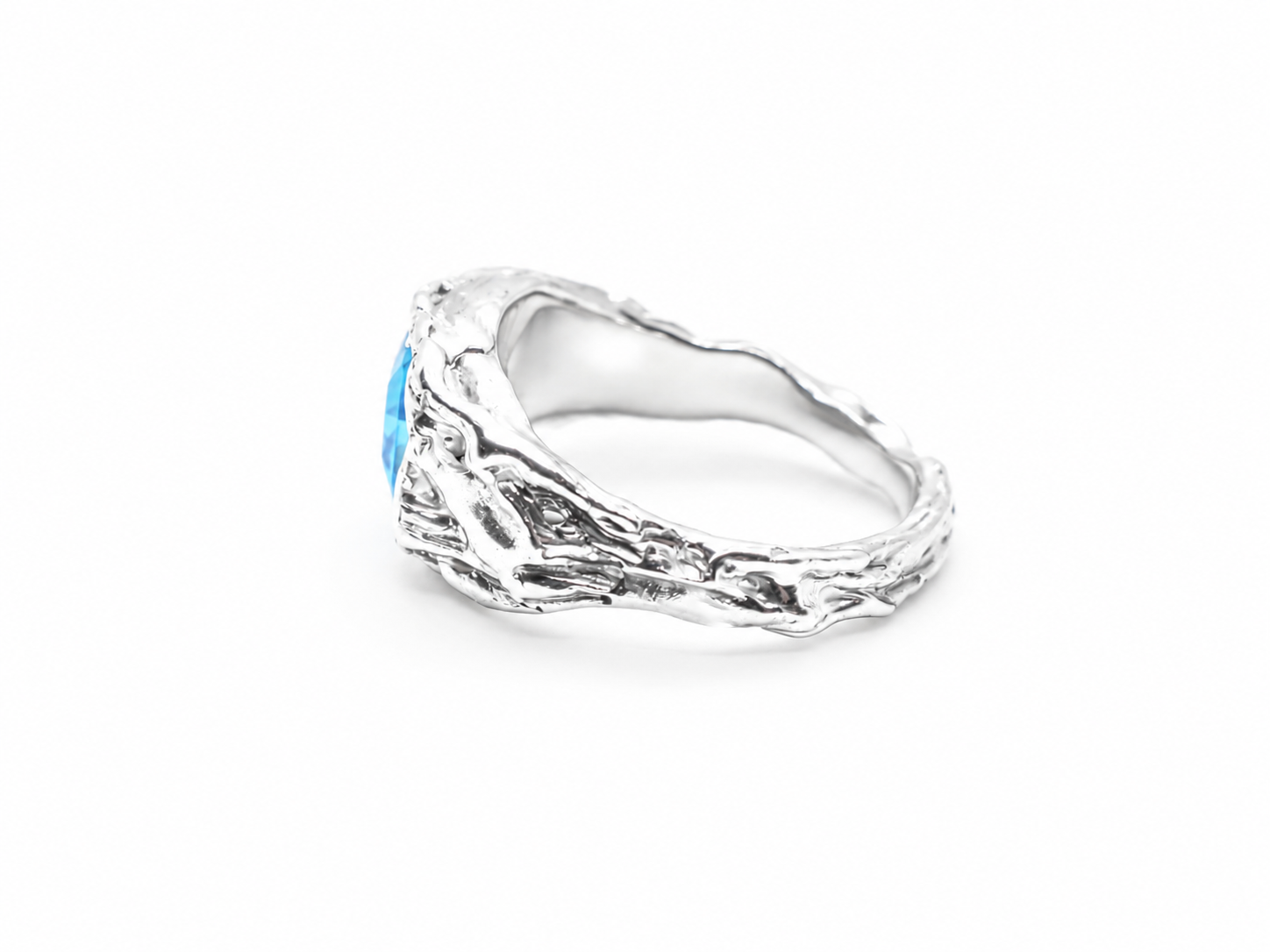 silver-blue-topaz-ring-angled-side-view.png