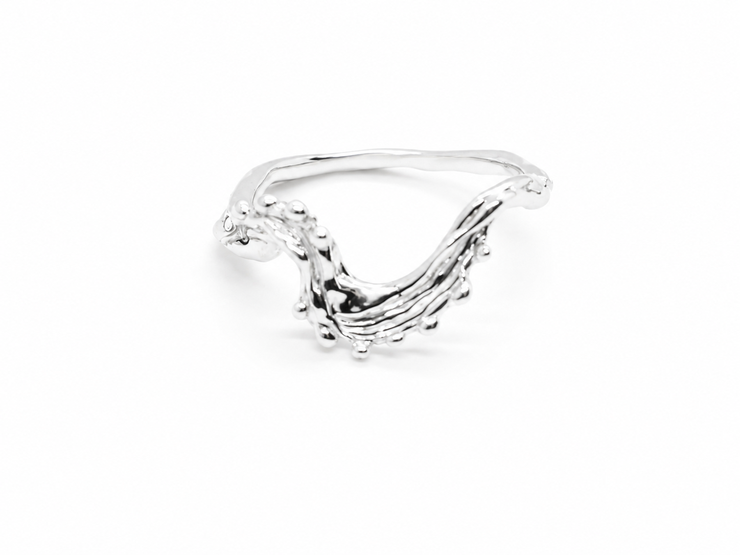 silver-dotted-wave-ring-angled-side-view.png