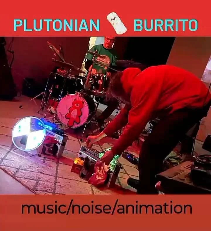 A band performing with a drum set decorated with a red bear, under a banner that reads 'Plutonian Burrito', with additional text 'music/noise/animation' at the bottom.