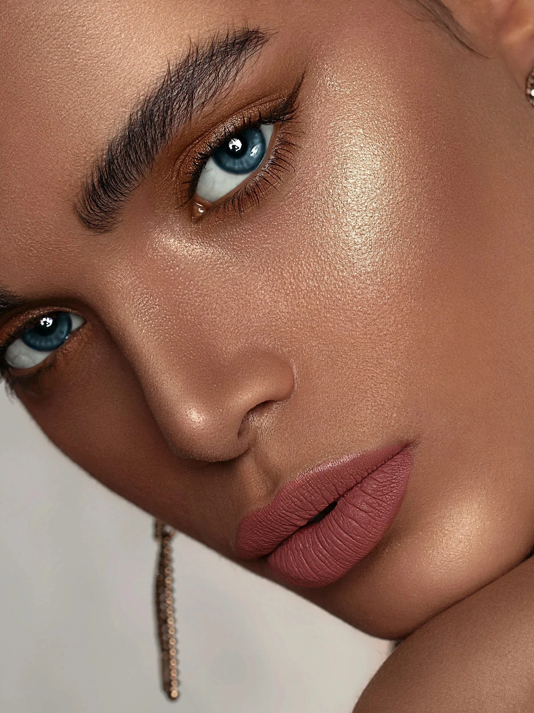 Woman with face of makeup. Soft pink lipstick.