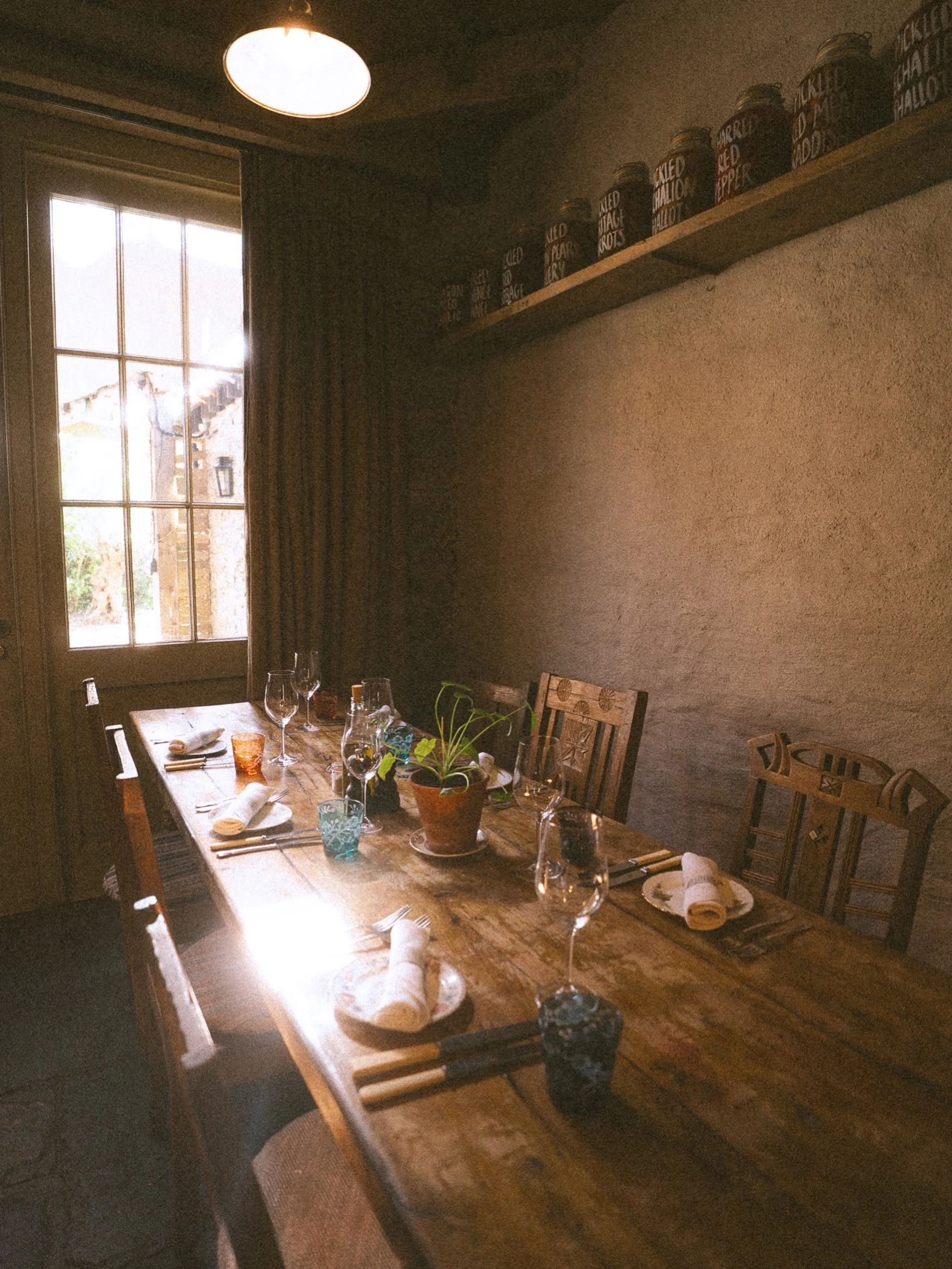 A little snapshot of how light falls so beautifully. Home-grown herbs on wooden tables, walls holding secrets of countless conversations and the feeling of nostalgia of the space through moments you weren&rsquo;t even a part of. A very magical hotel 
