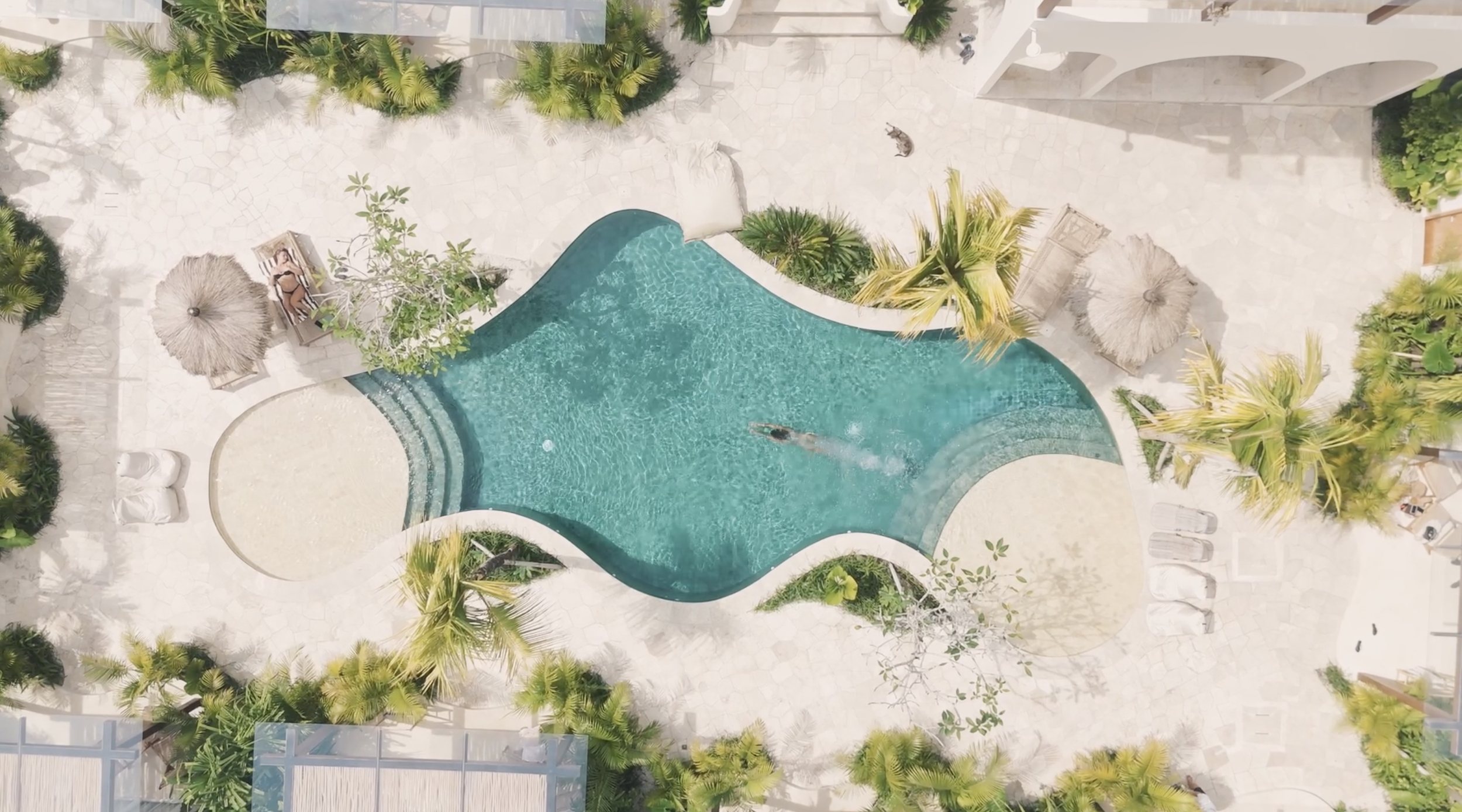 Aerial drone shot of boutique hotel pool, Cornwall