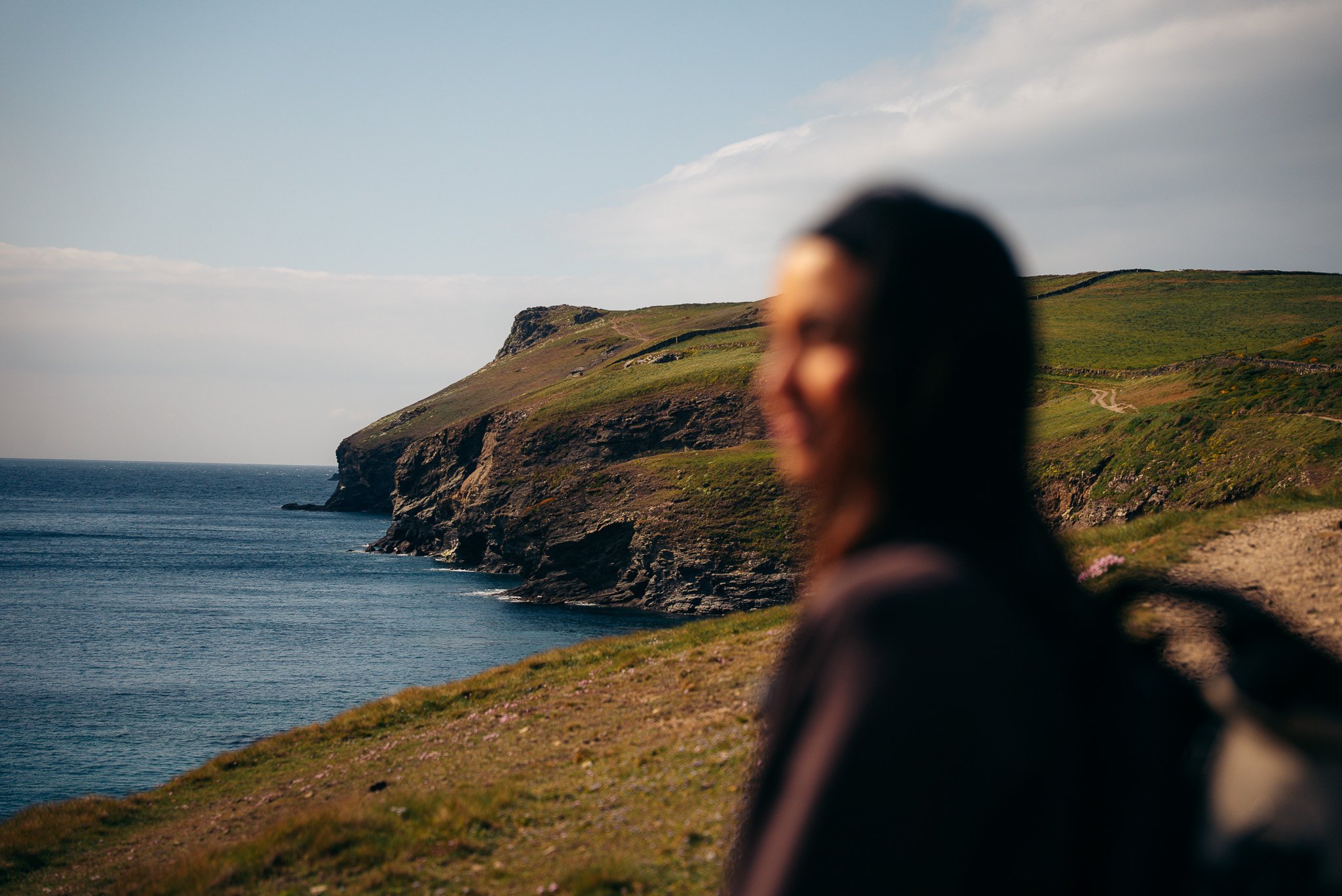 Brand videographer Ellinor on the Cornish cliffs, Cornwall