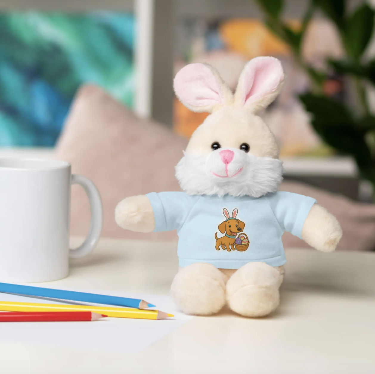 Cute Easter Bunny Plush Toy Wearing a blue t-shirt featuring Cody The Dachshund Dog from Little Sausage Big World